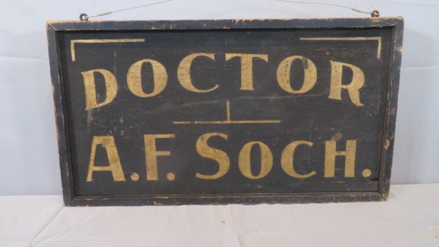 Wood trade sign for Doctor A.F. Soch., 2-sided: Wood trade sign for Doctor A.F. Soch., 2-sided, molding around the circumference of the sign, 14"T x 25"W x 2"D