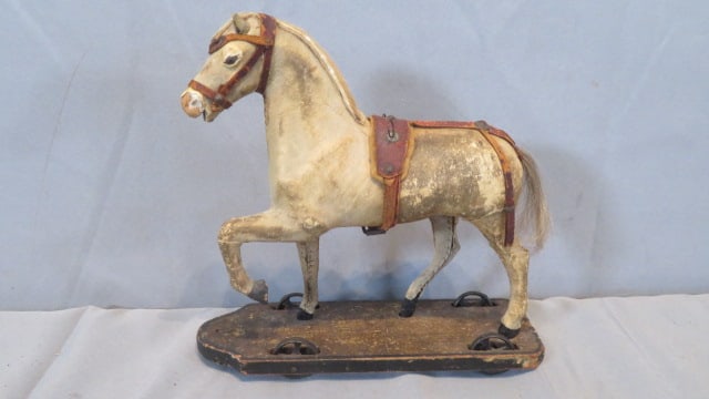 Late 19th century hide-covered toy horse on iron wheels (1 of 7)
