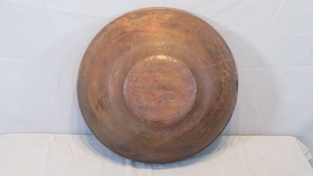 Early 21" turned wood bowl: Early 21" turned wood bowl, 7.25"deep, laced leather make-do repair, original old patina