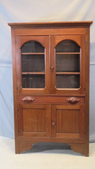 19th century walnut glass door cupboard: Late 19th century walnut glass door cupboard with drawer and 2 blind doors below, 70" x 40 1/2" x 16"