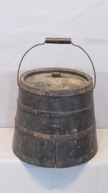 Early 20th century wood kerosene keg with metal bands: Early 20th century wood kerosene keg with metal bands in old black paint, wire bale, and wood handle, 12"T x 12"diam (at bottom)