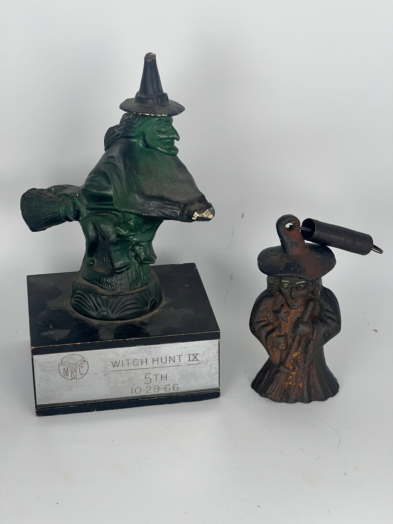 Two Cast Iron Witches: 1966 c/I witch trophy & c/I bouncing witch on a spring. Trophy 6"W x 8"T. Spring Weight 2"x 5"