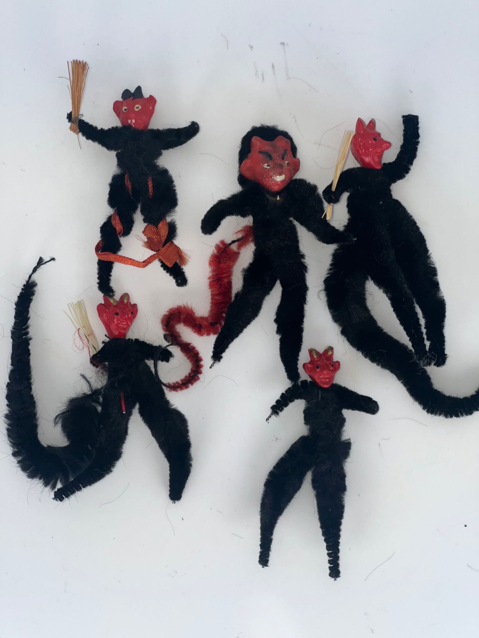 Group of Five Krumpas Ornaments: Group of 5 Krumpas Chenille body ornaments. Black chenille bodies with red composite heads.