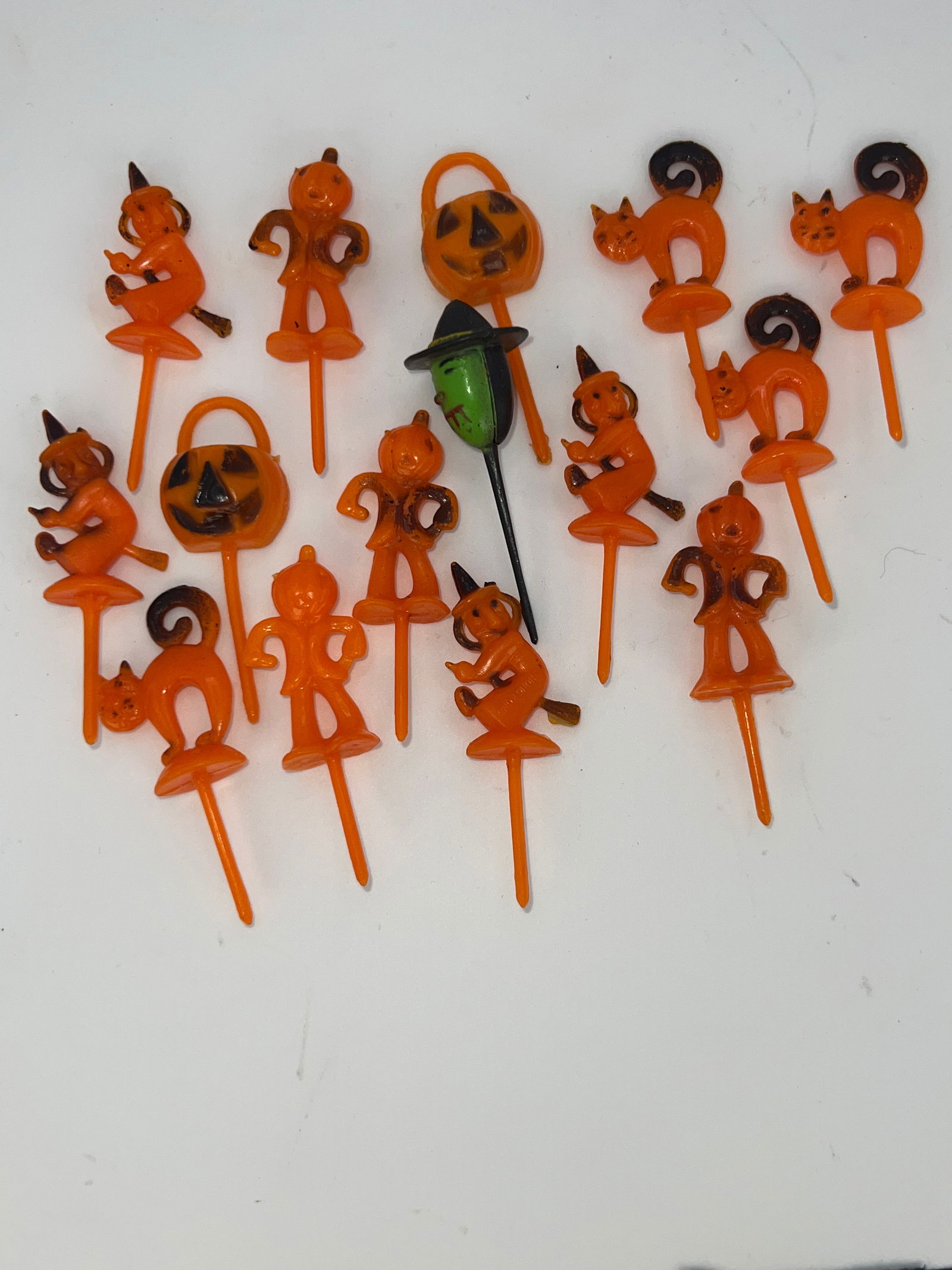 Group of Plastic Halloween Cupcake Sticks: 16 plastic Halloween cupcake sticks of various Halloween shapes.