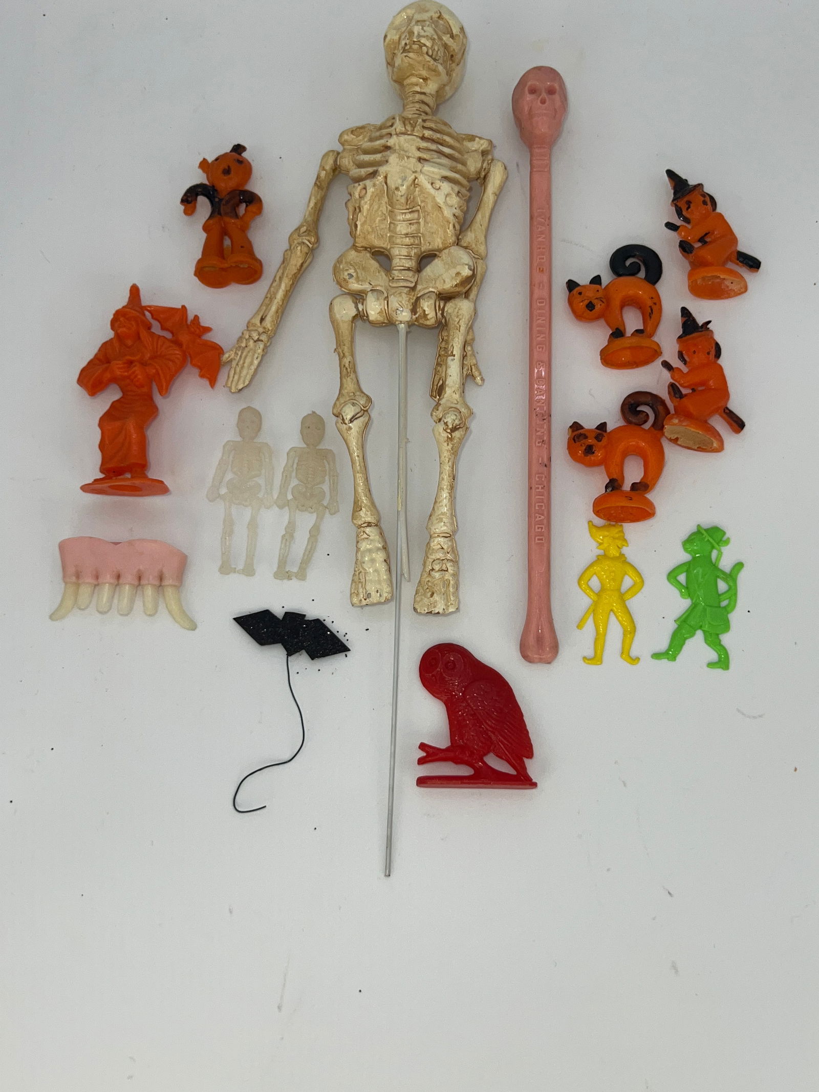 Group of Plastic Halloween Cake Toppers: 13 plastic Halloween cake toppers of various Halloween shapes & one large skeleton cake topper.