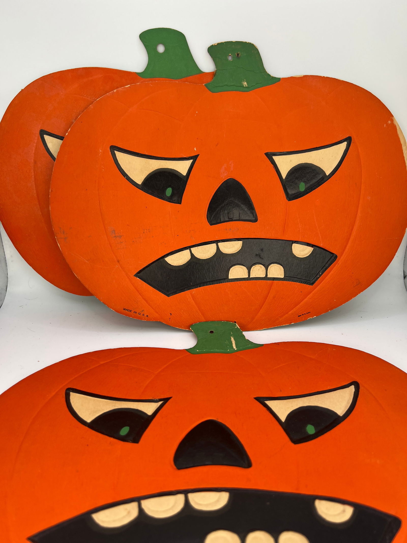 1940's Three Die Cut Cardboard Jack O'Lanterns: 1940's embossed cardboard die cut angry face Jack O'Lanterns marked H.E. Luhrs. Made in USA. Good condition. 12"W x 9"T