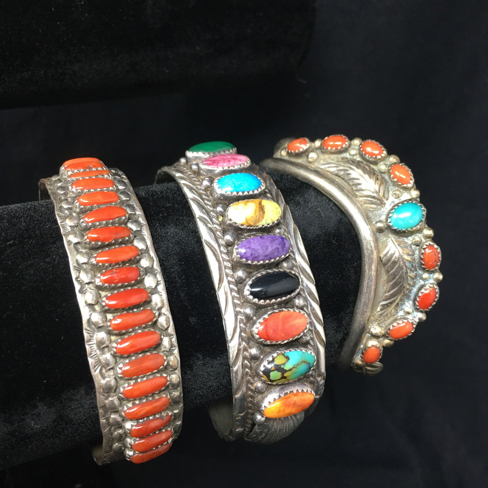 (3) Sterling Cuff Bracelets, F.W. Zuni & YJ: (3) Sterling Cuff Bracelets, 1.) Fred Weekoty Zuni 18 Coral stone cuff bracelet, marked "F.W. Zuni", 5/8" width, 4-7/8" inside circumference plus 1-1/4" gap, total weight 30.9 grams 2.) (9)Multicolor