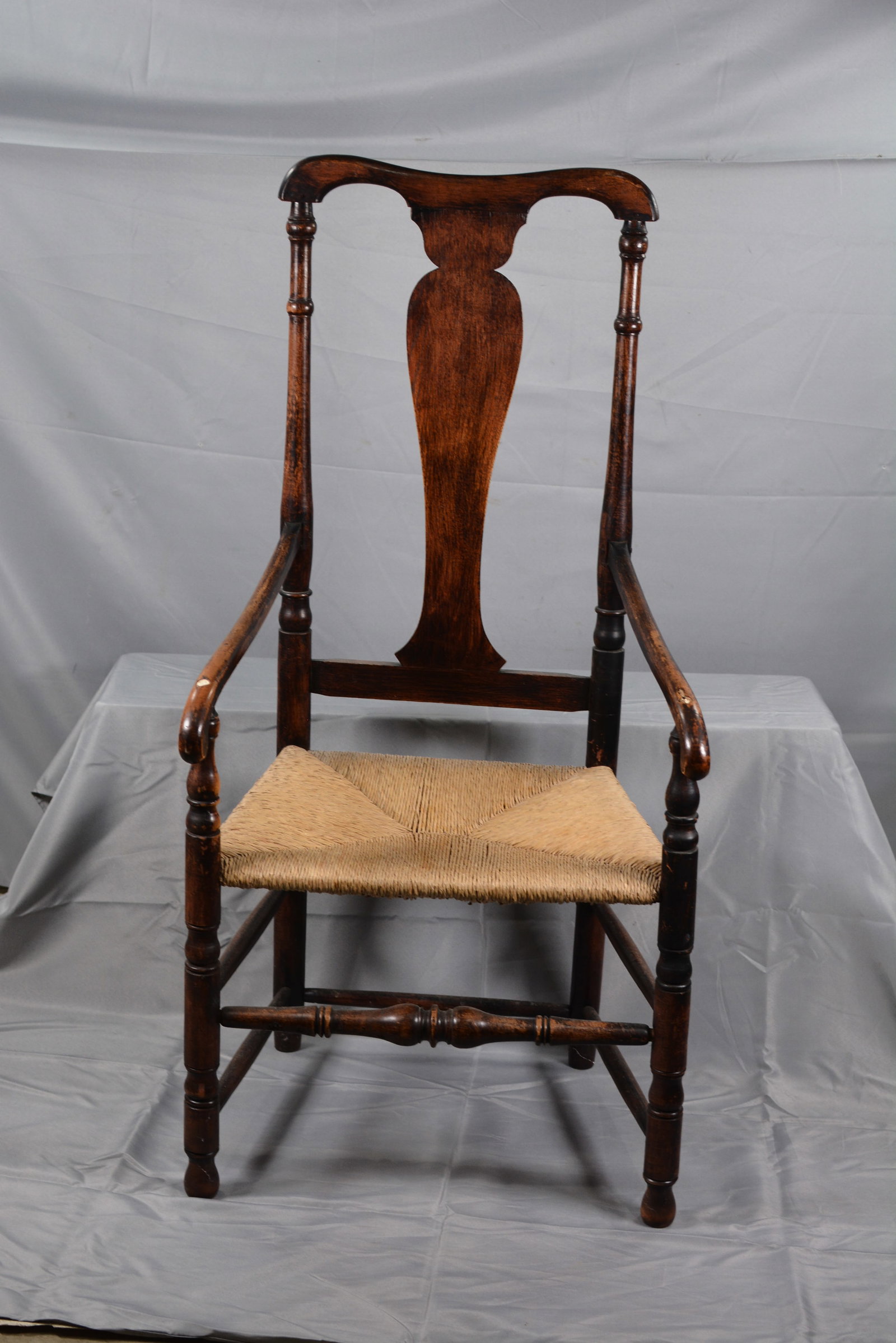 18th Century Queen Anne Arm Chair: 18th Century Queen Anne arm chair w/ rush seat, legs ended out. 23"W x 20"D x 48" T From the collection of Doug & Sandy Davies