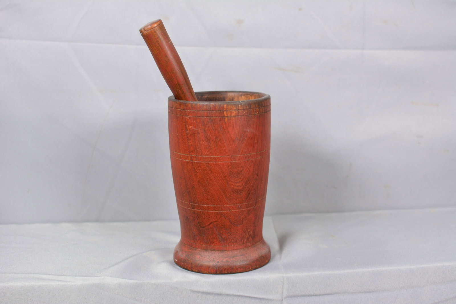 Early Morter & Pestal in Old Red Paint: Old red paint early morter w/ 4 incised bands & matching pedestle. 6"Deep morter. Morter 5"W x 8 1/2"T Pestal 10"T. From the Collection of Roselyn Potts.