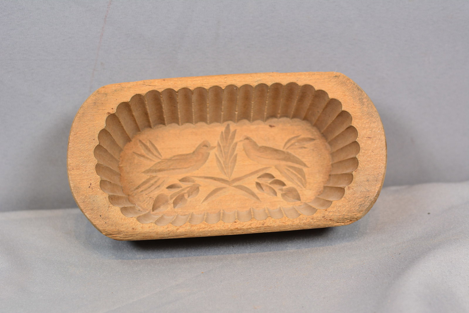 French Butter Mold w/ Birds: French butter mold w/birds, deep scalloped edged & finger w/finger grooves. 3 1/2"W x 7"T. From the Collection of Roselyn Potts.