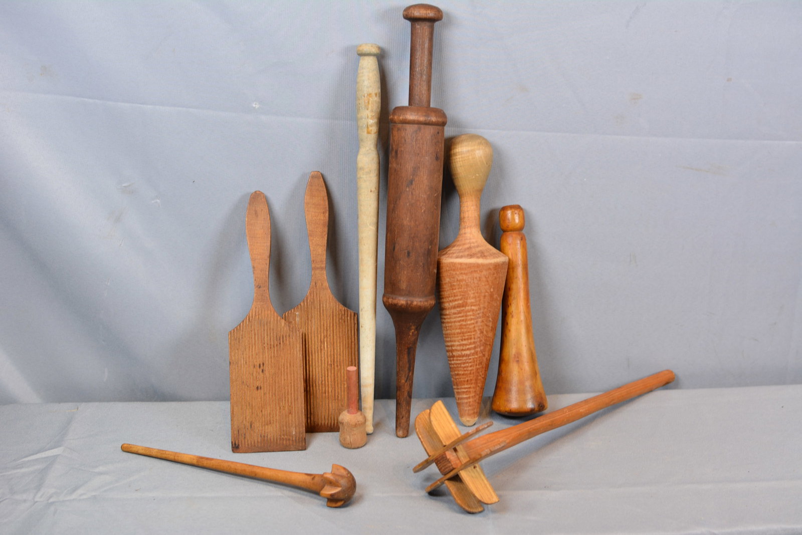 Group of Woodware: Group of woodenware includes butter workers, sausage stuffer, & pestle. Largest 16"T x 2"D. From the Collection of Roselyn Potts.