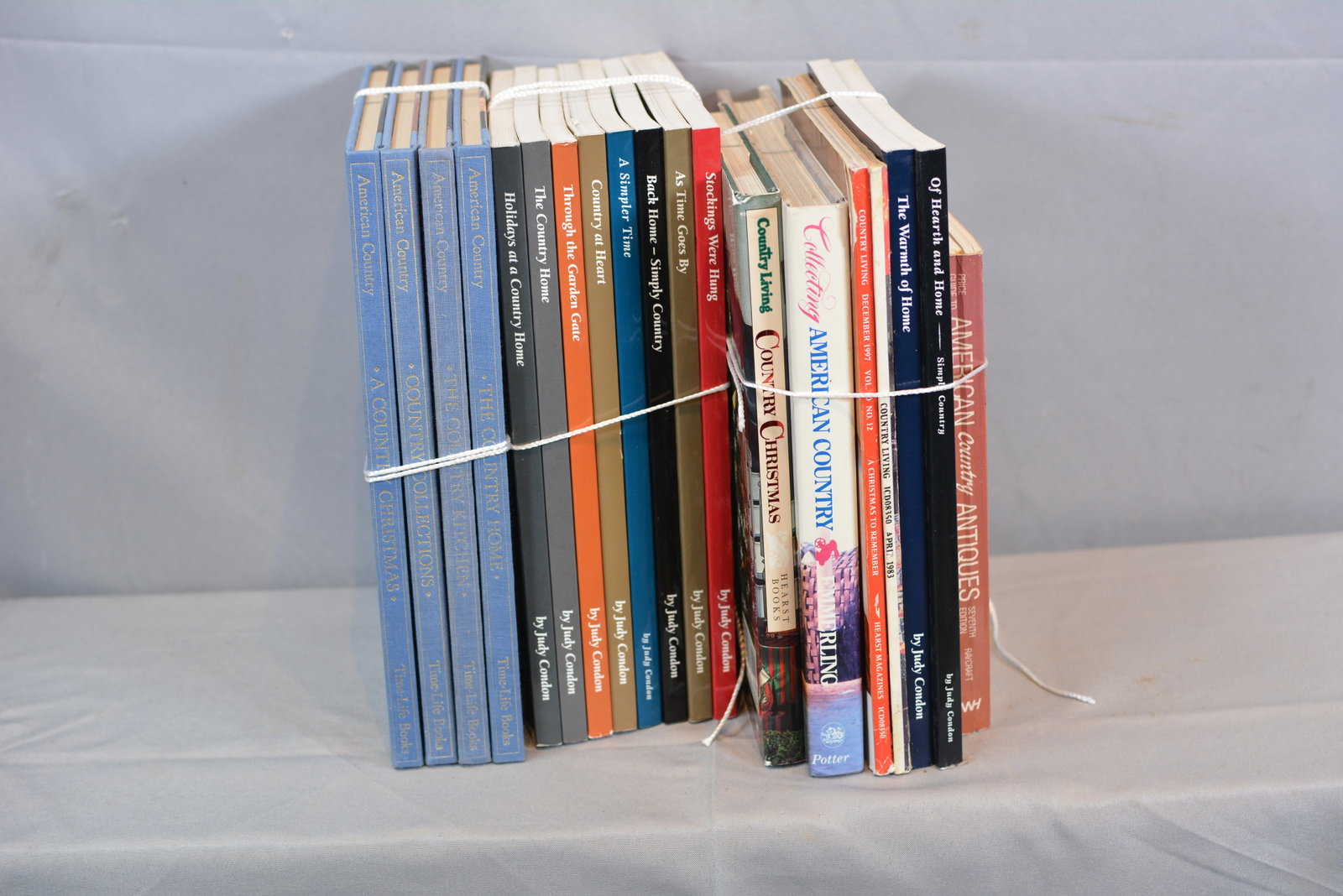Group of Country Books By Judy Condon & Others: 8 books by Judy Condon, 4 American Country Books, & 7 country decorating books Stack of books 9"W x 11"D x 10"
