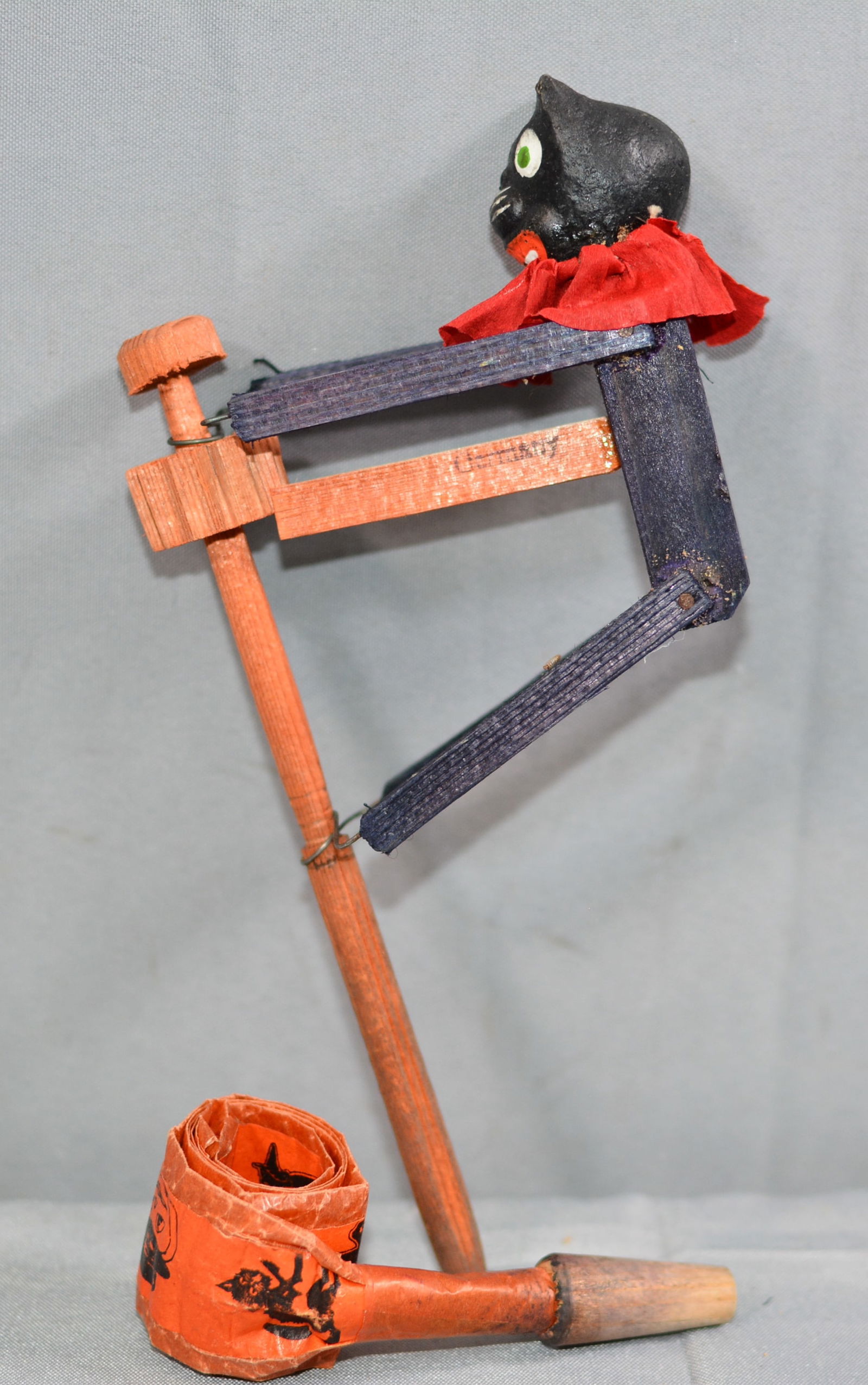 Item 1 is wooden rat-a-tat noise maker in form of cat wooden body and legs, crepe paper scarf and (1 of 4)