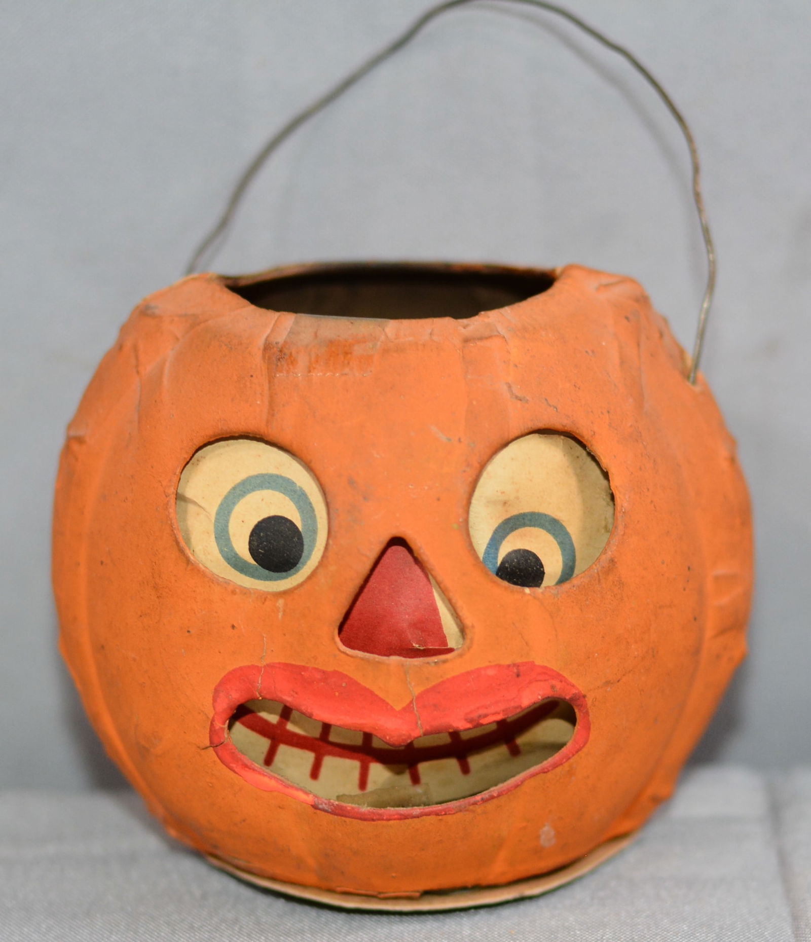 Paper pulp, early 1900, Jack O'Lantern with paper faced insert, tin candle holder, thin wire bail (1 of 6)