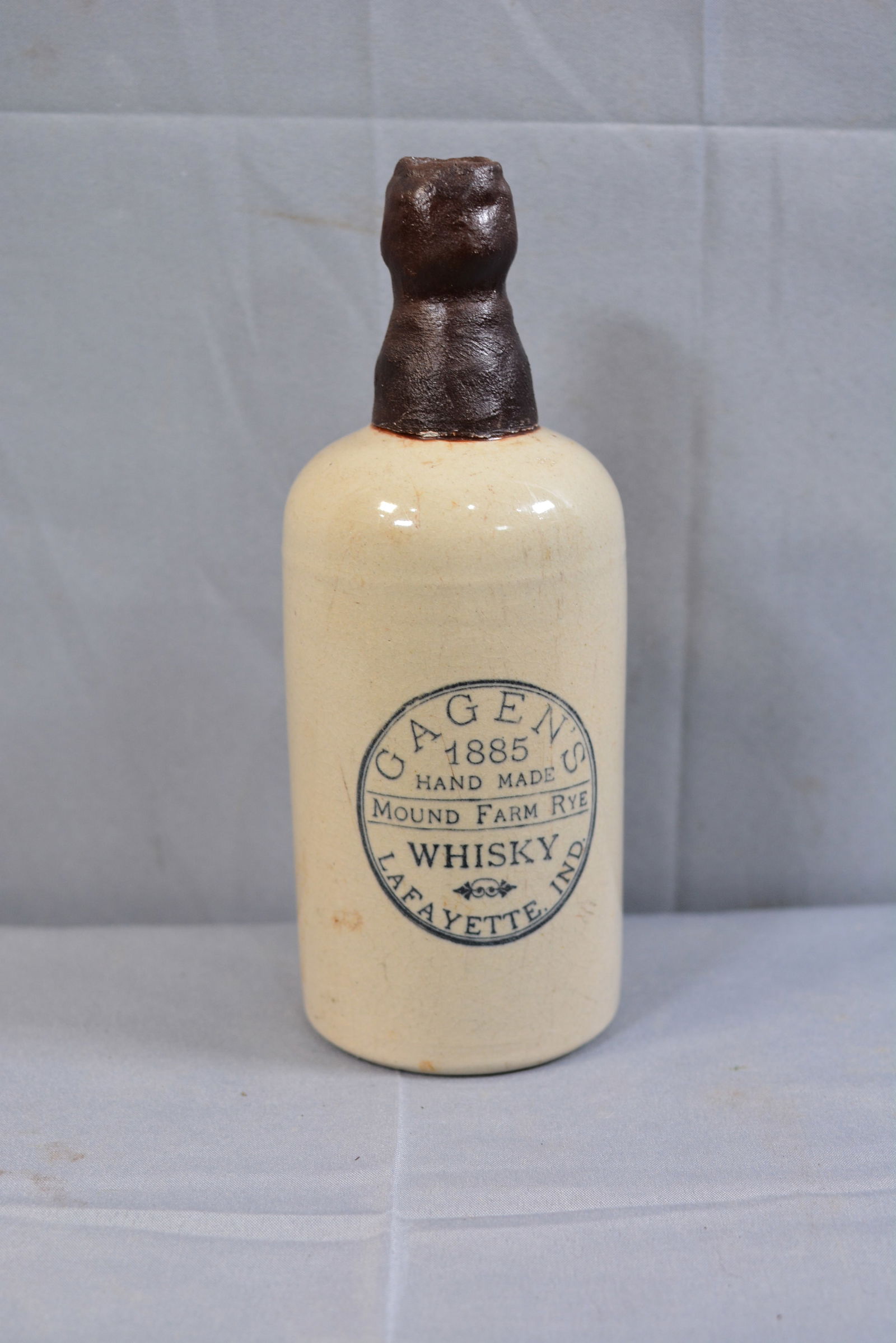 Gagen's 1885 Lafayette, IND., stoneware whiskey bottle, 3"X9": Gagen's 1885 Lafayette, IND., stoneware whiskey bottle, 3"X9"