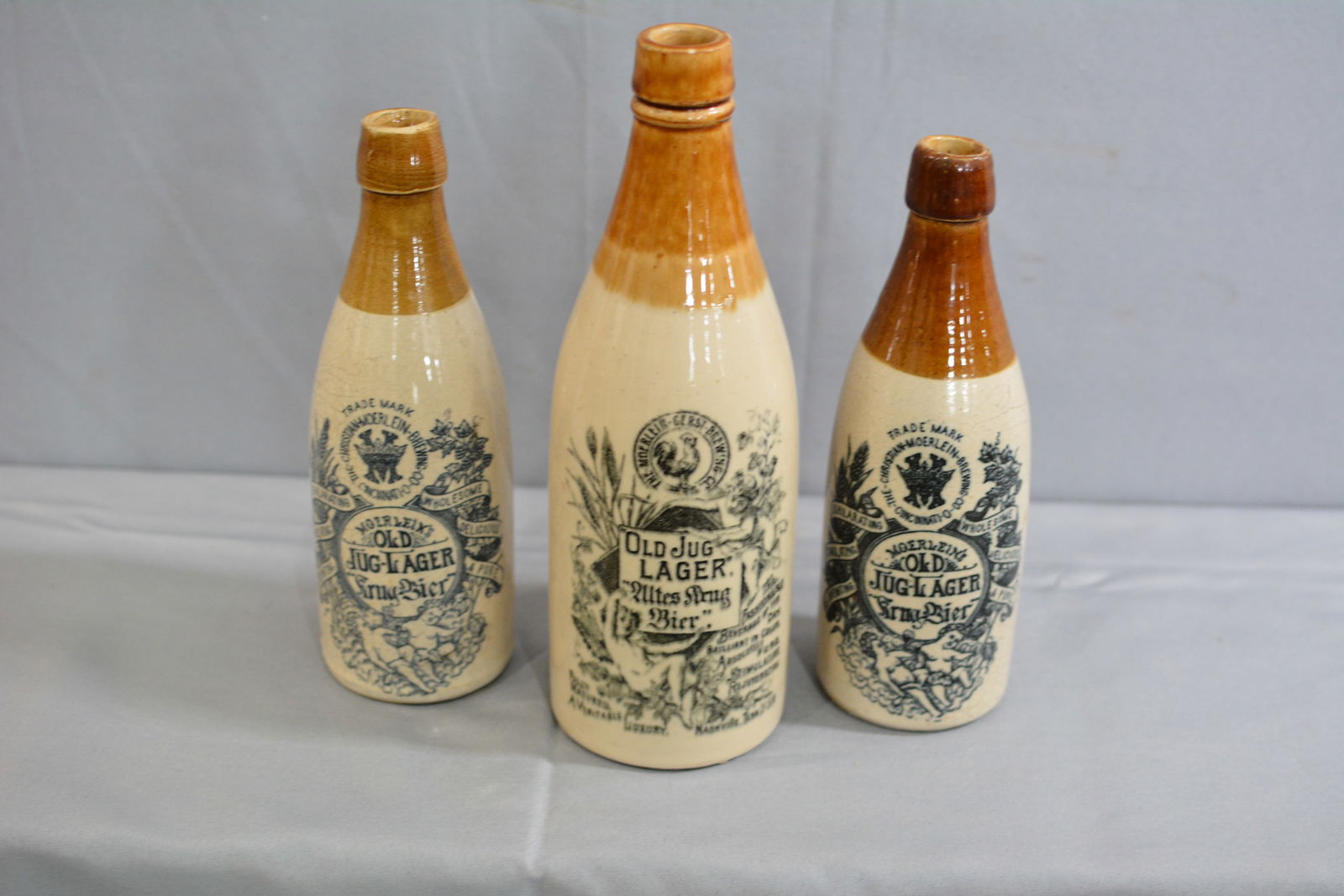 3 Stoneware Old Jug Lager Advertising Bottles, Christian Moerlein Brewing Co, Cincinnati, Ohio.: 3 Stoneware Old Jug Lager Advertising Bottles, Christian Moerlein Brewing Co, Cincinnati, Ohio.