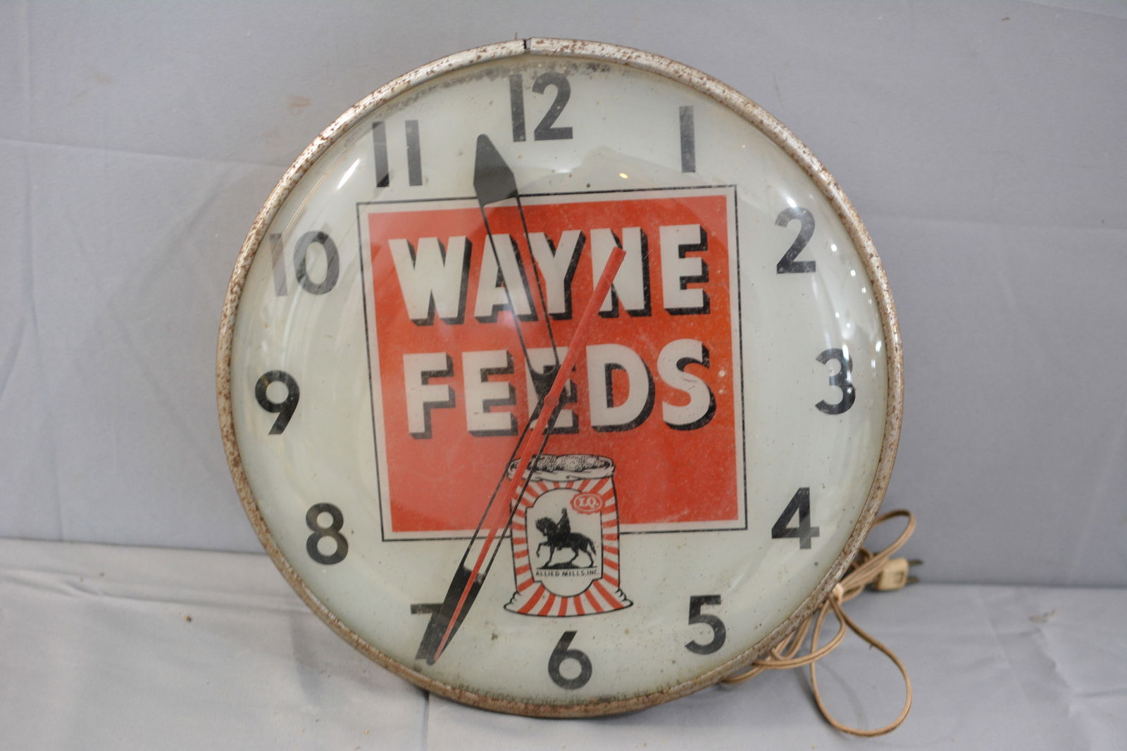 Waynes Feed Advertising Clock, lighted, in working condition, red and white graphics with a (1 of 6)