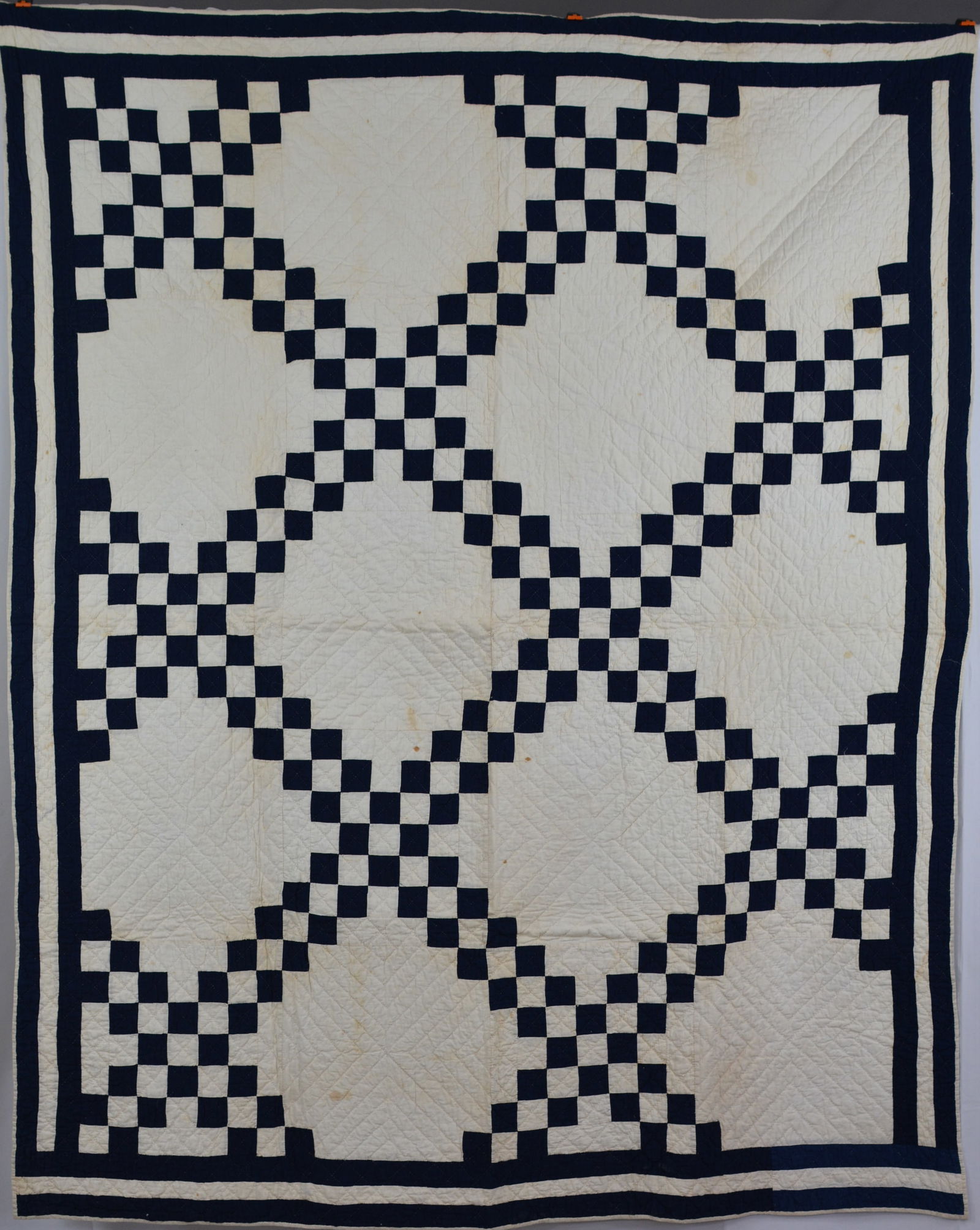 Double Irish Chain quilt in indigo blue. Lower right hand border band appears to have been repaired. (1 of 6)