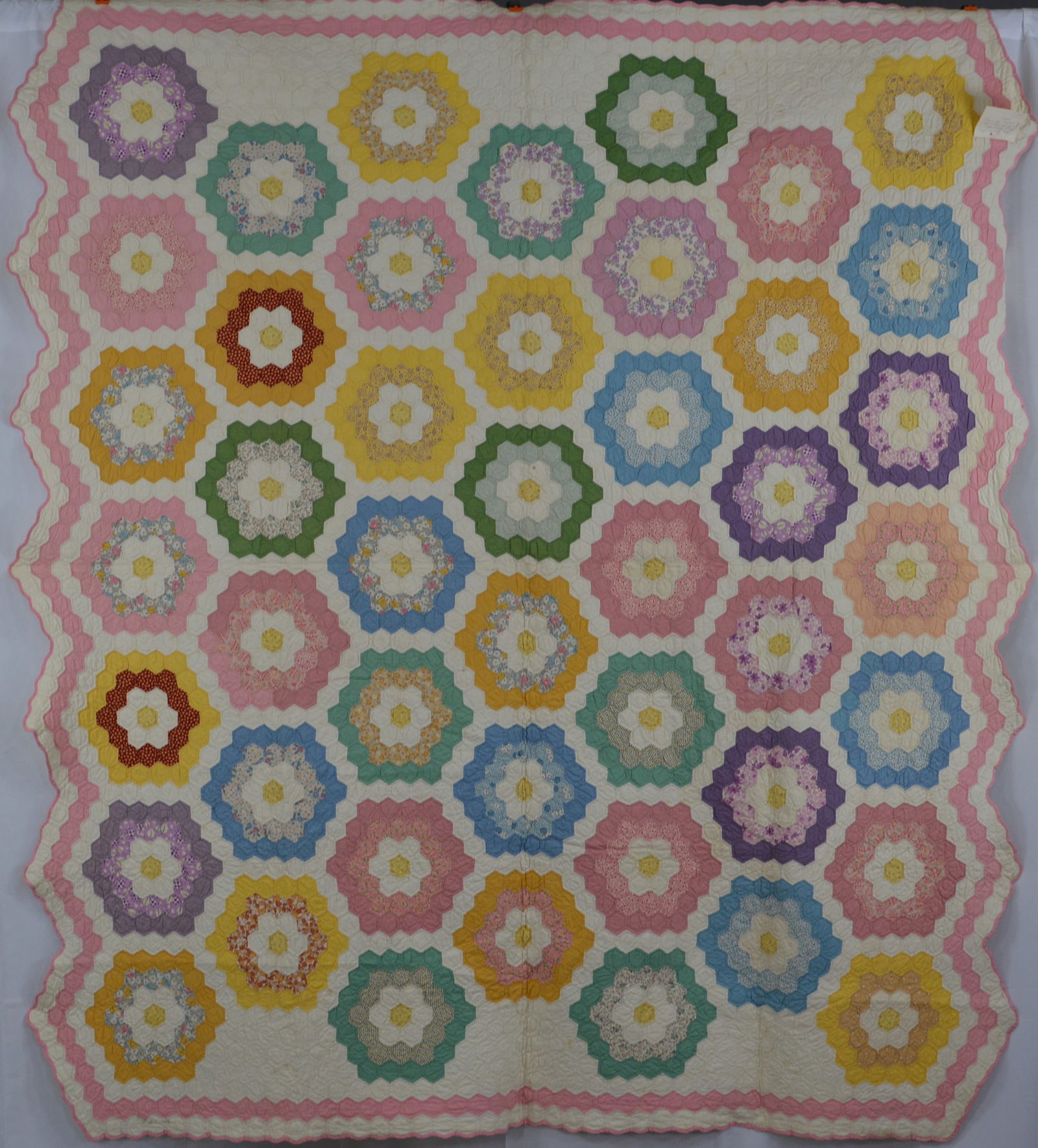 1925 Grandma's Flower Garden quilt w/ scalloped border in pastel colors. Has 56 blocks. 80"L x 72"W (1 of 6)