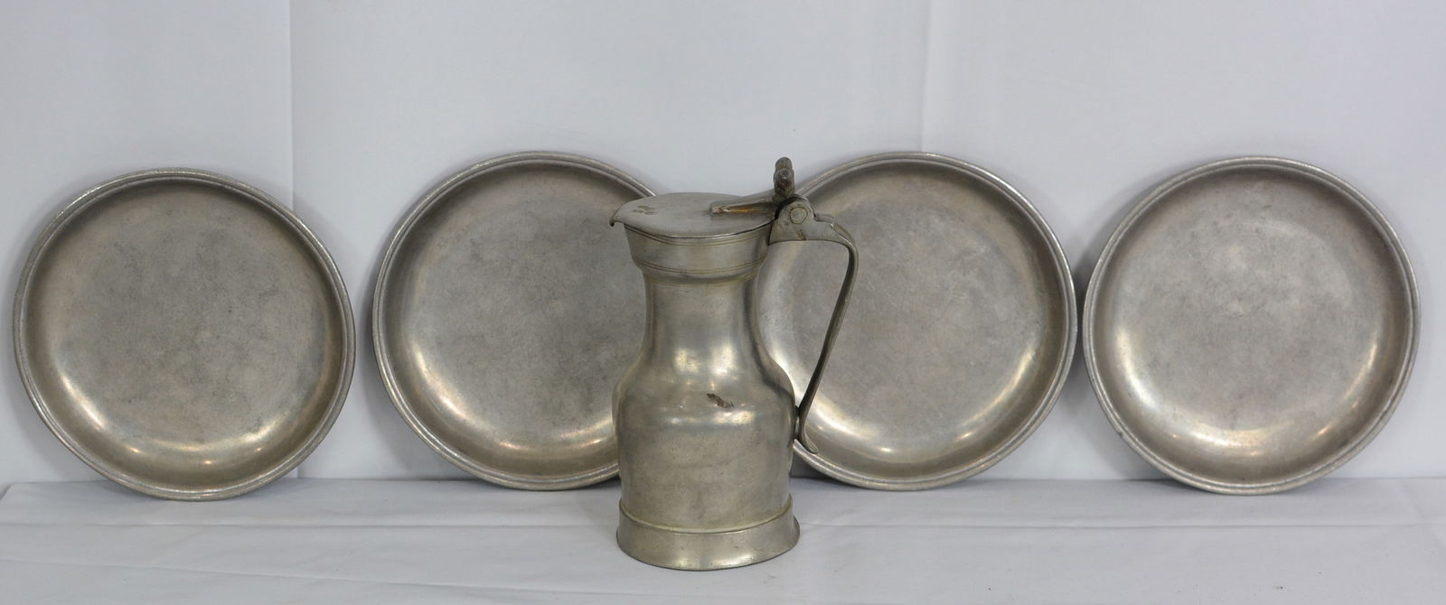 5 Pewter Plates and Pitcher which is touched marked and dated 1748, 6"x1" (1 of 7)