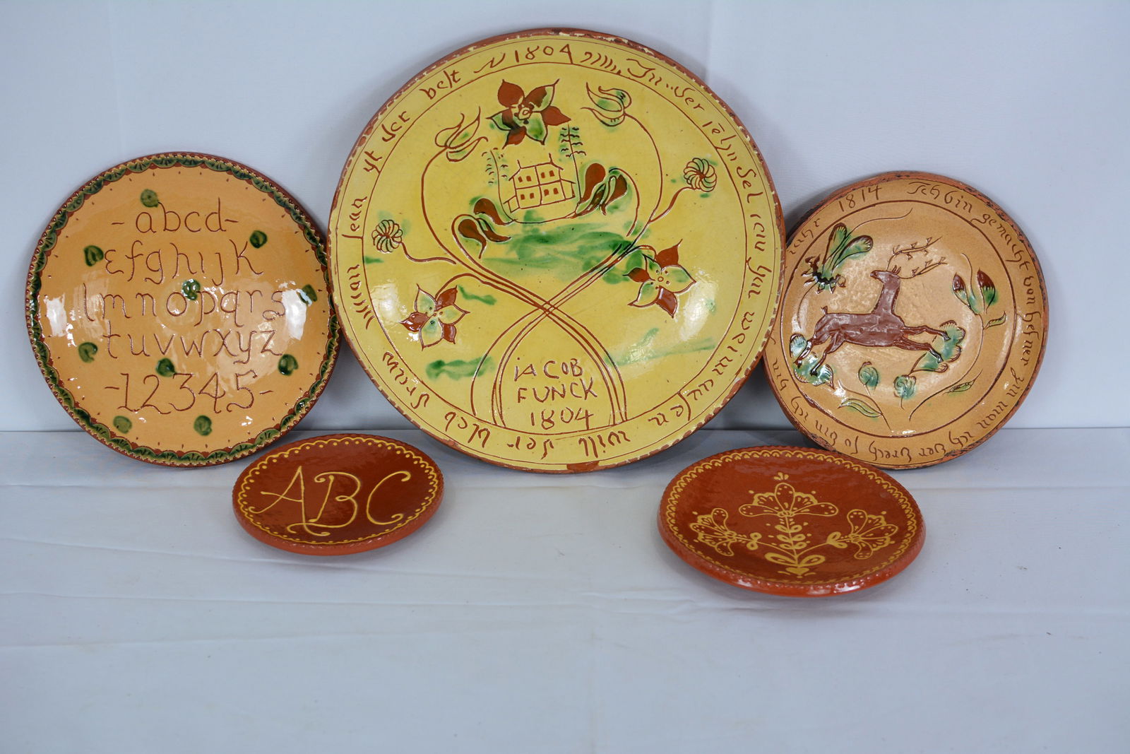 Turtlecreek and Others Platters (5) Redware decorated in PA German folk art design. Sizes from 10" (1 of 11)