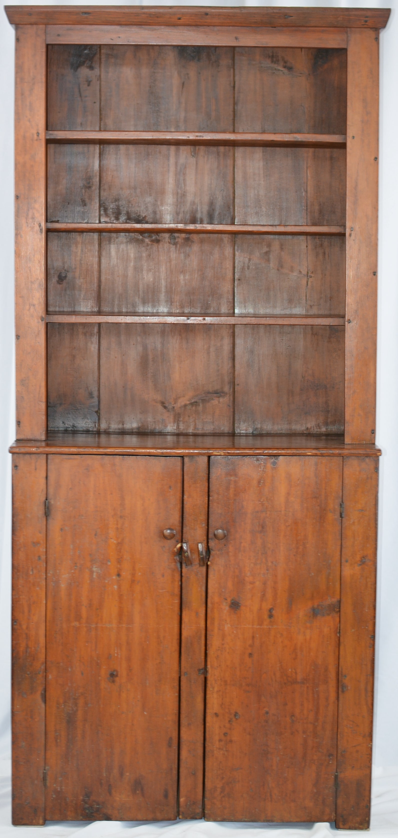 Pine Open Top Step Back Cupboard, 2 lower plank doors, wooden knobs, 3 upper shelves, interior lower: Pine Open Top Step Back Cupboard, 2 lower plank doors, wooden knobs, 3 upper shelves, interior lower is painted cream, the back has red paint, 38"W x 85"T x 17"D