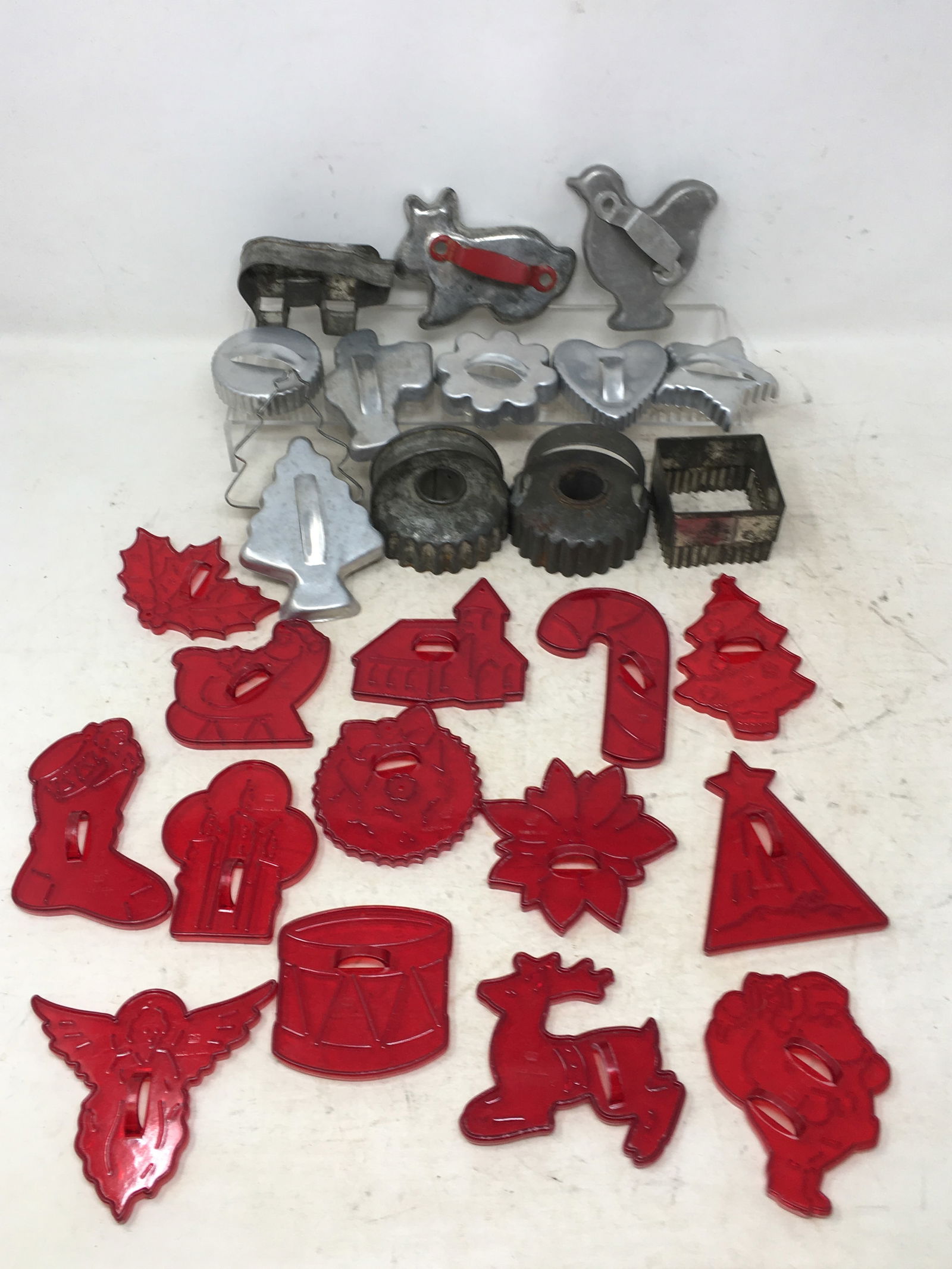 (27) Vintage Holiday Cookie Cutters, Tin & Red Plastic. (14) Red plastic Christmas cookie cutters.: (27) Vintage Holiday Cookie Cutters, Tin & Red Plastic. (14) Red plastic Christmas cookie cutters. (13) tin cookie cutters incl. pig & red handled rabbit. Rabbit 4"L