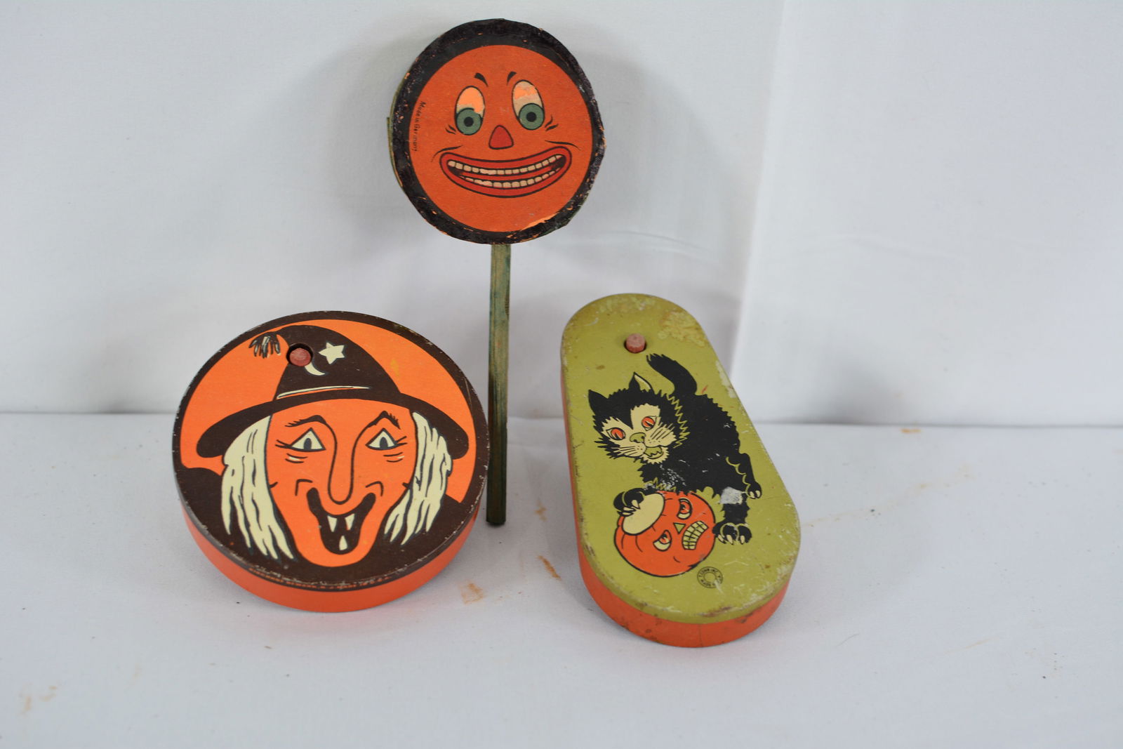 Three vintage Halloween noise makers, jack o lantern face rattle, German and 2 tin litho rattlers (1 of 2)