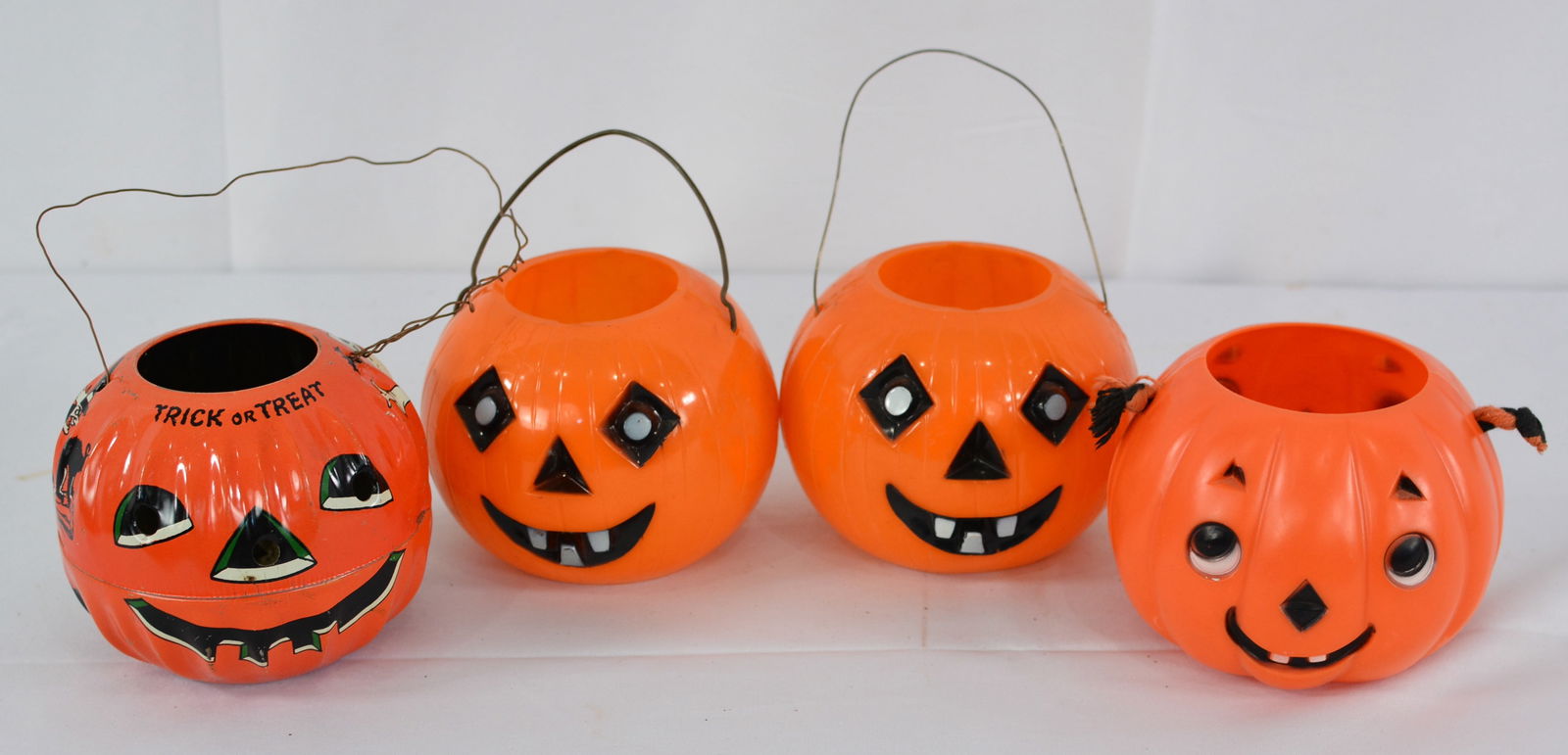 Four Vintage Halloween candy container jock o lanterns, 3 plastic, one is tin litho, 4"X4" (1 of 2)