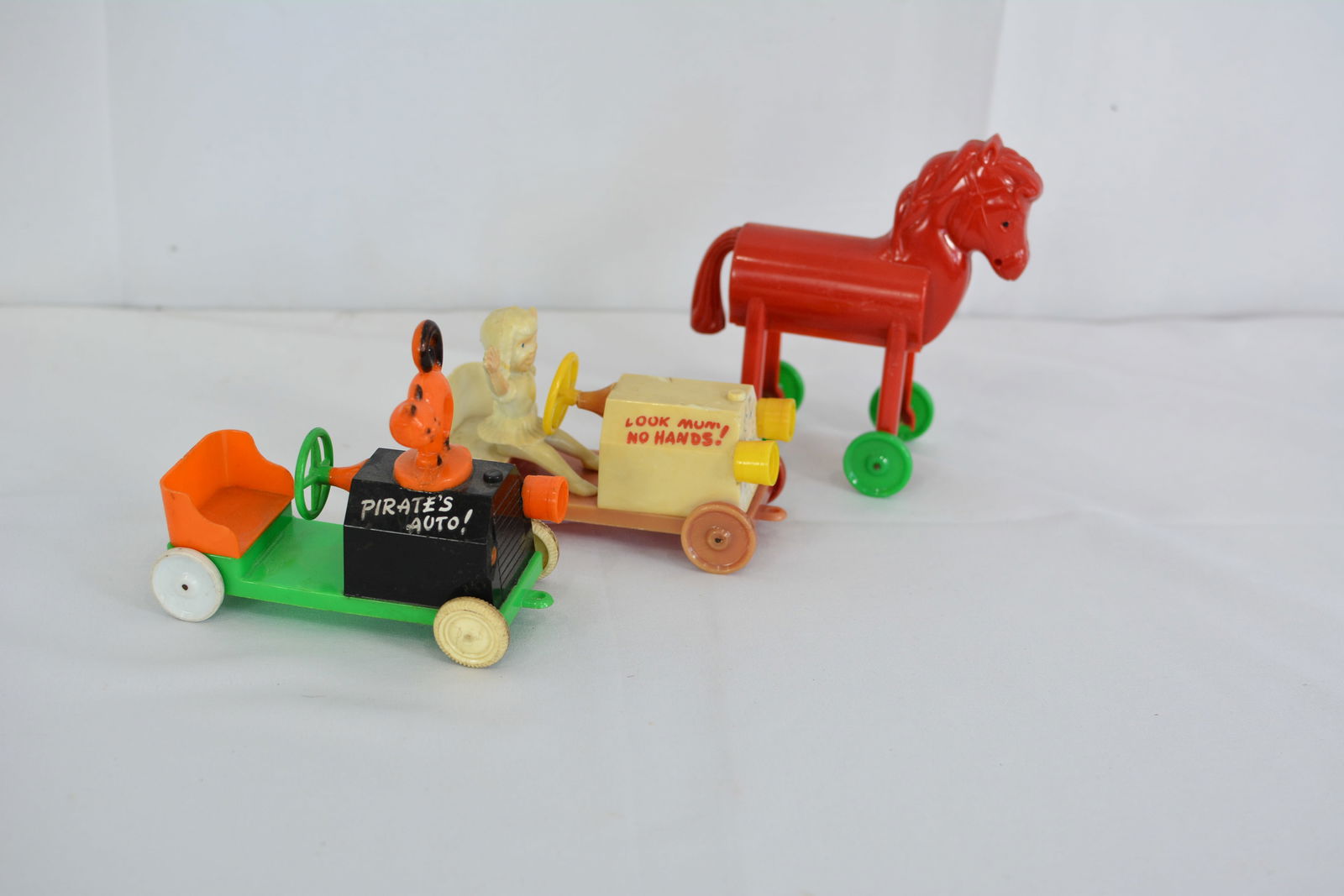 1950s Rosbro plastic candy containers: Halloween Pirate Auto!, Girl driving car "Look Mom No Hands",: 1950s Rosbro plastic candy containers: Halloween Pirate Auto!, Girl driving car "Look Mom No Hands", Red Trojan horse. All approx. 5" x 2 1/2" x 5"