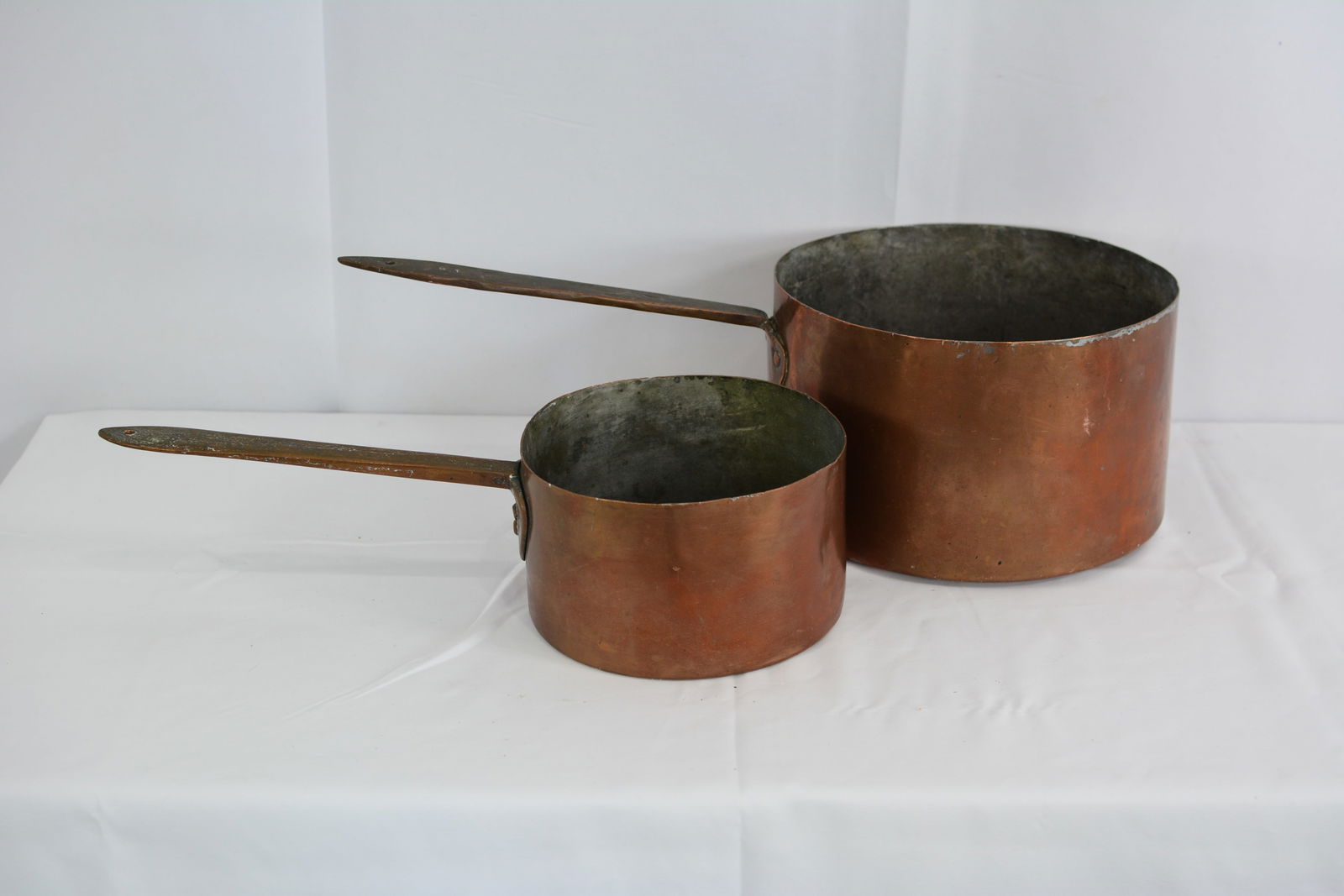 Two Copper sauce pans w/ copper handles & one w/incised 18 on the handle. Dovetailed construction. (1 of 8)