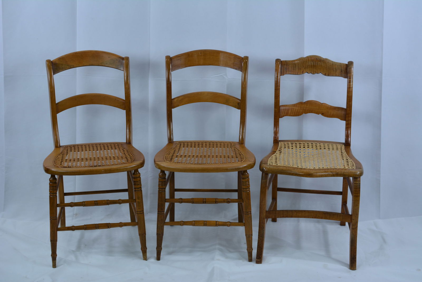 One tiger maple & 2 maple side chairs w/cane seats.: One tiger maple & 2 maple side chairs w/cane seats.