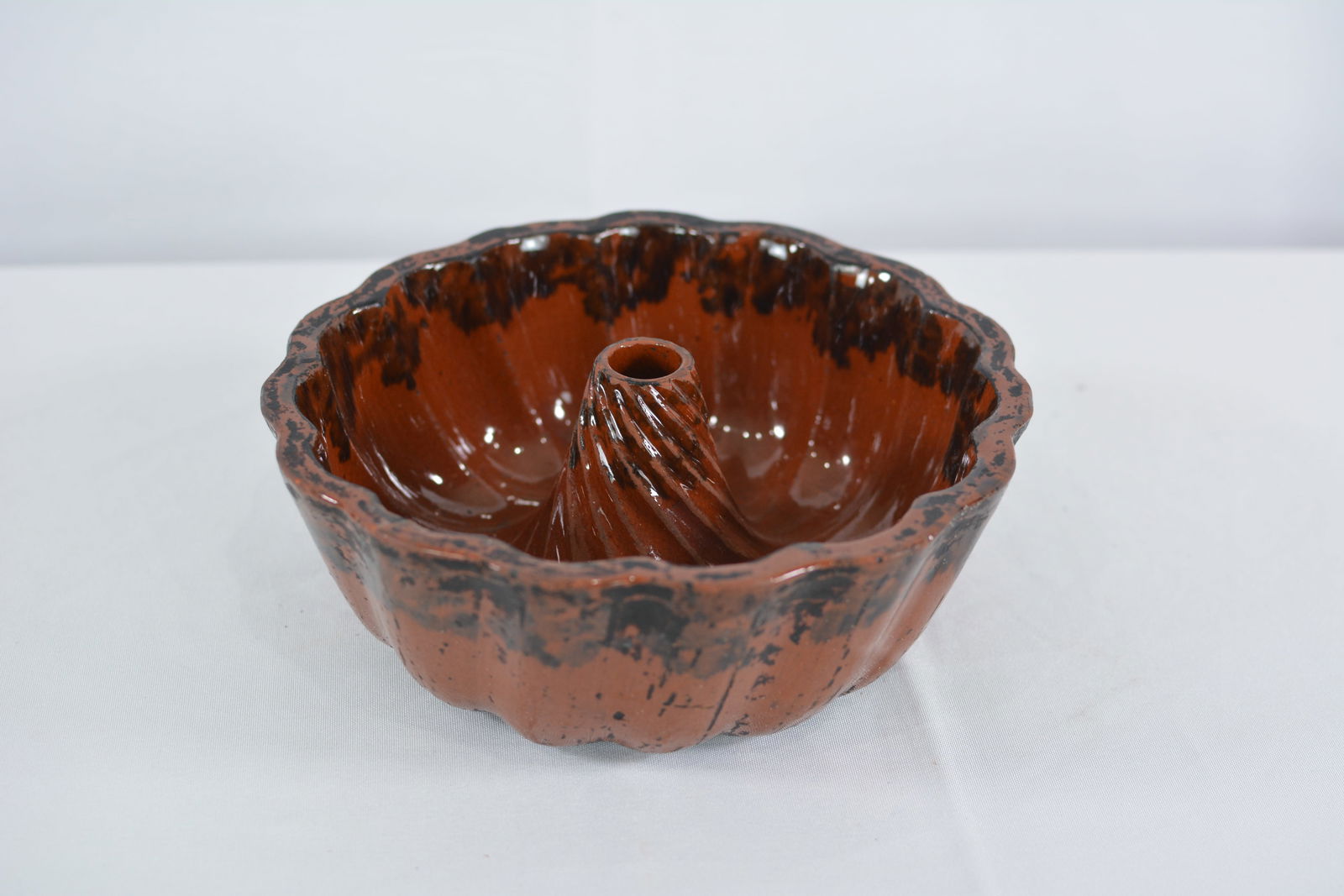 Turks Head redware food mold w/ dark brown & black spongeware glaze. (1 of 5)