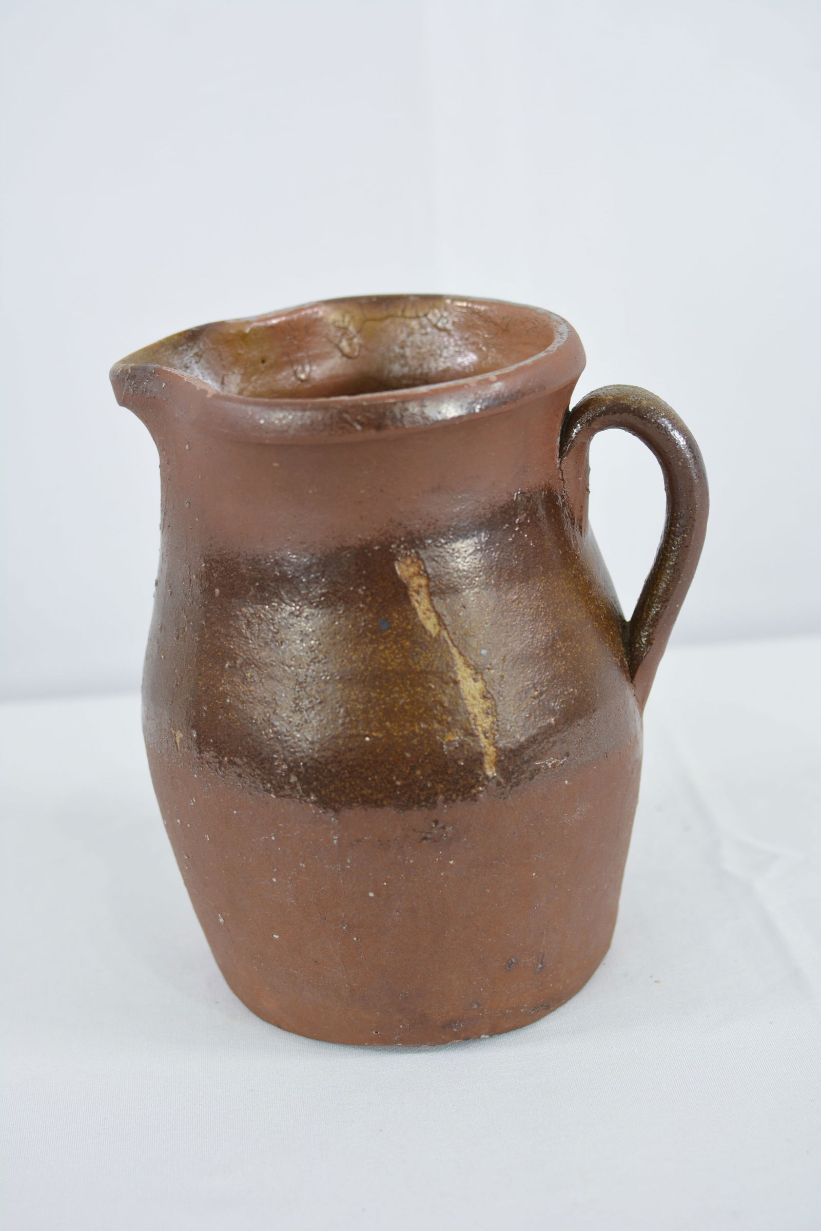 19th Century redware pitcher, probably Charles Graham Chemical Pottery Works. (1 of 3)