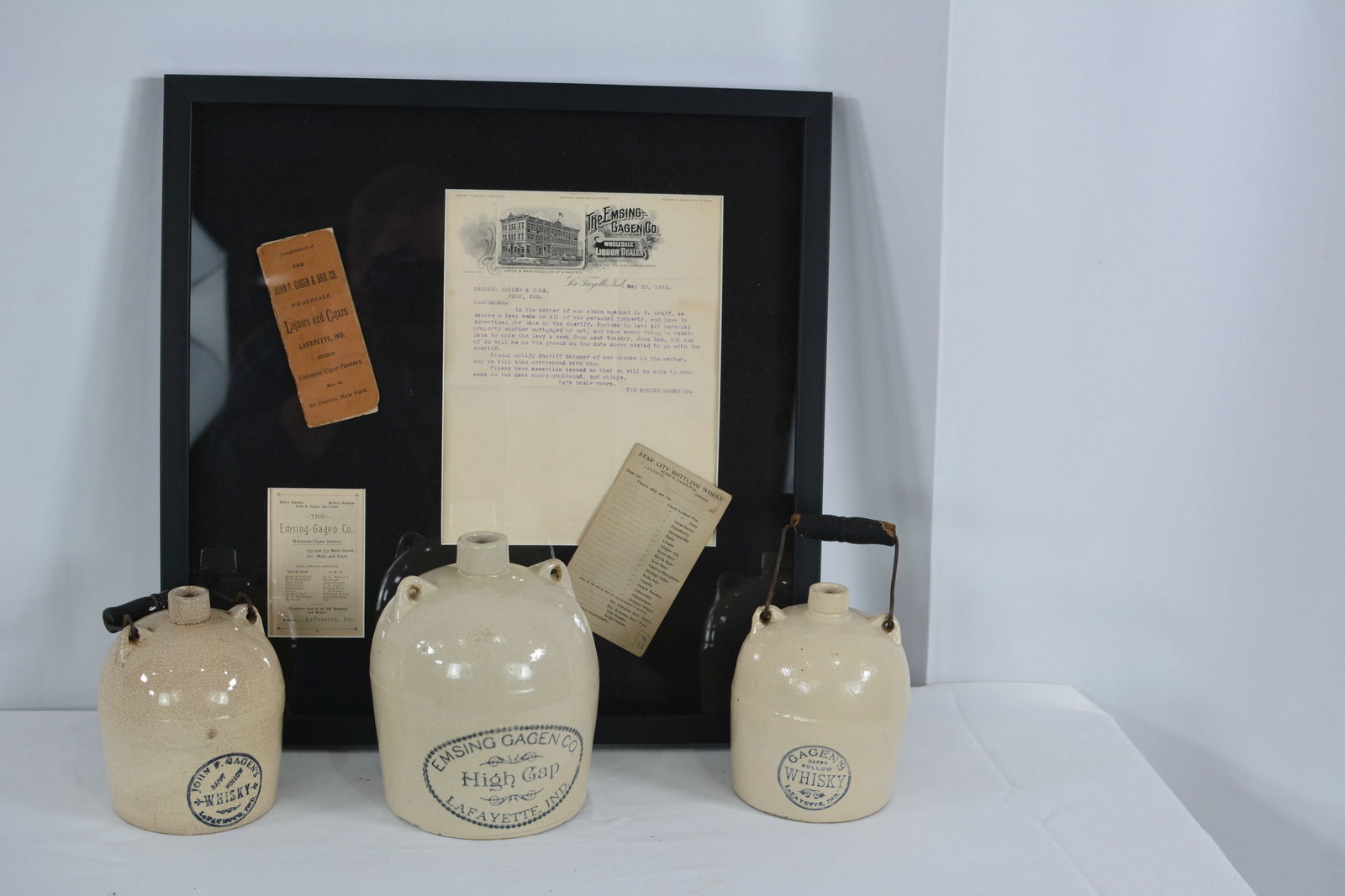 3 stoneware jugs w/Gagen Lafayette Indiana advertising & framed Gagen ephemera.: 3 stoneware jugs w/Gagen Lafayette Indiana advertising & framed Gagen ephemera.