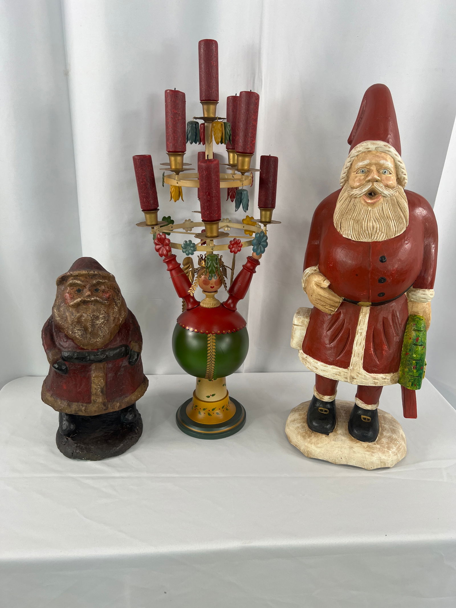 Group of Christmas Decor: Group of Christmas Decor, Swedish Folk Art Candle Tree, Paper Pulp Santa marked Fairfield Folk Art Inc., Resin Santa.