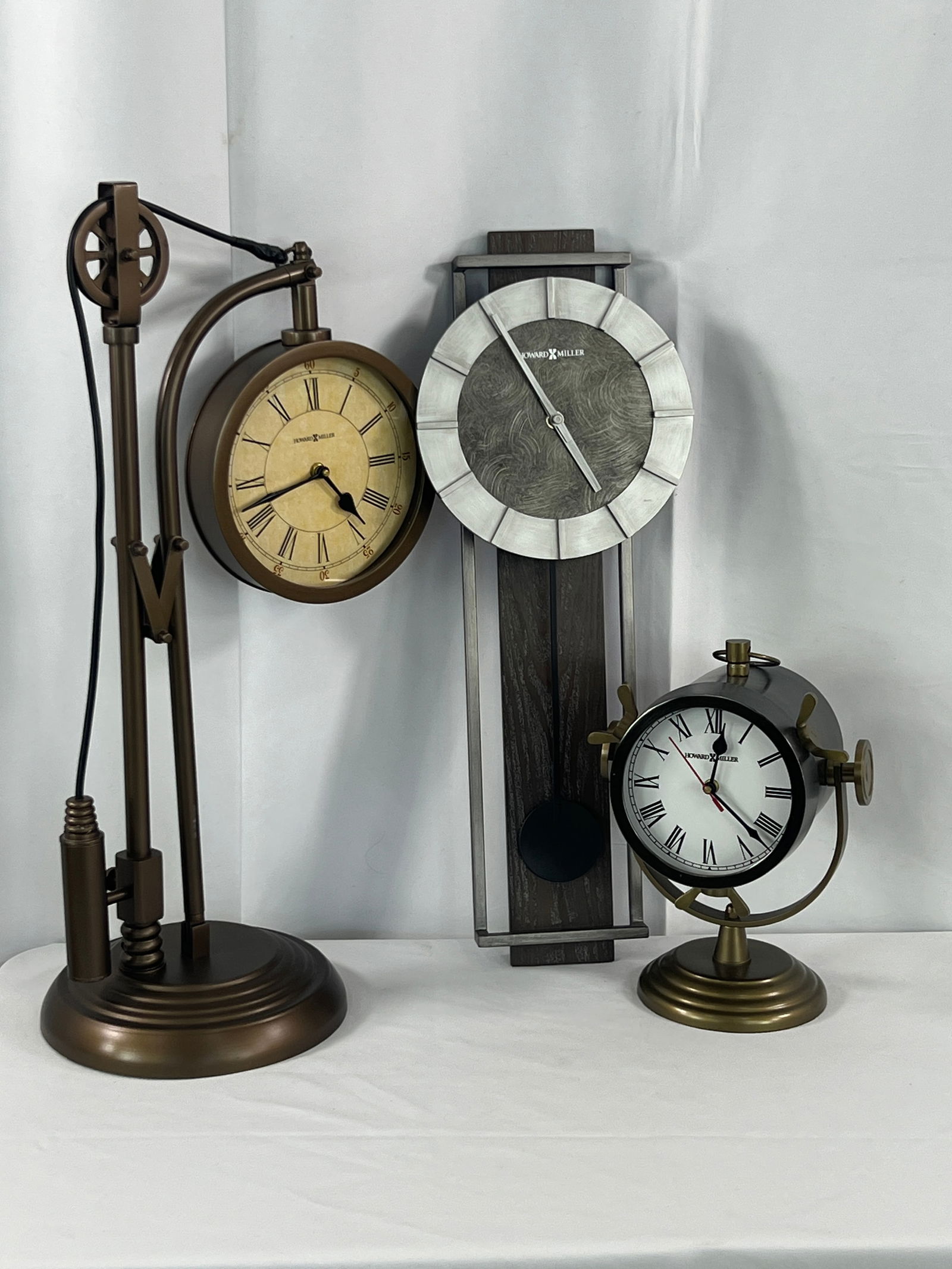 3 Howard Miller Clocks: 3 Howard Miller Clocks, Vernazza, Lakeside, and Oscar clock.