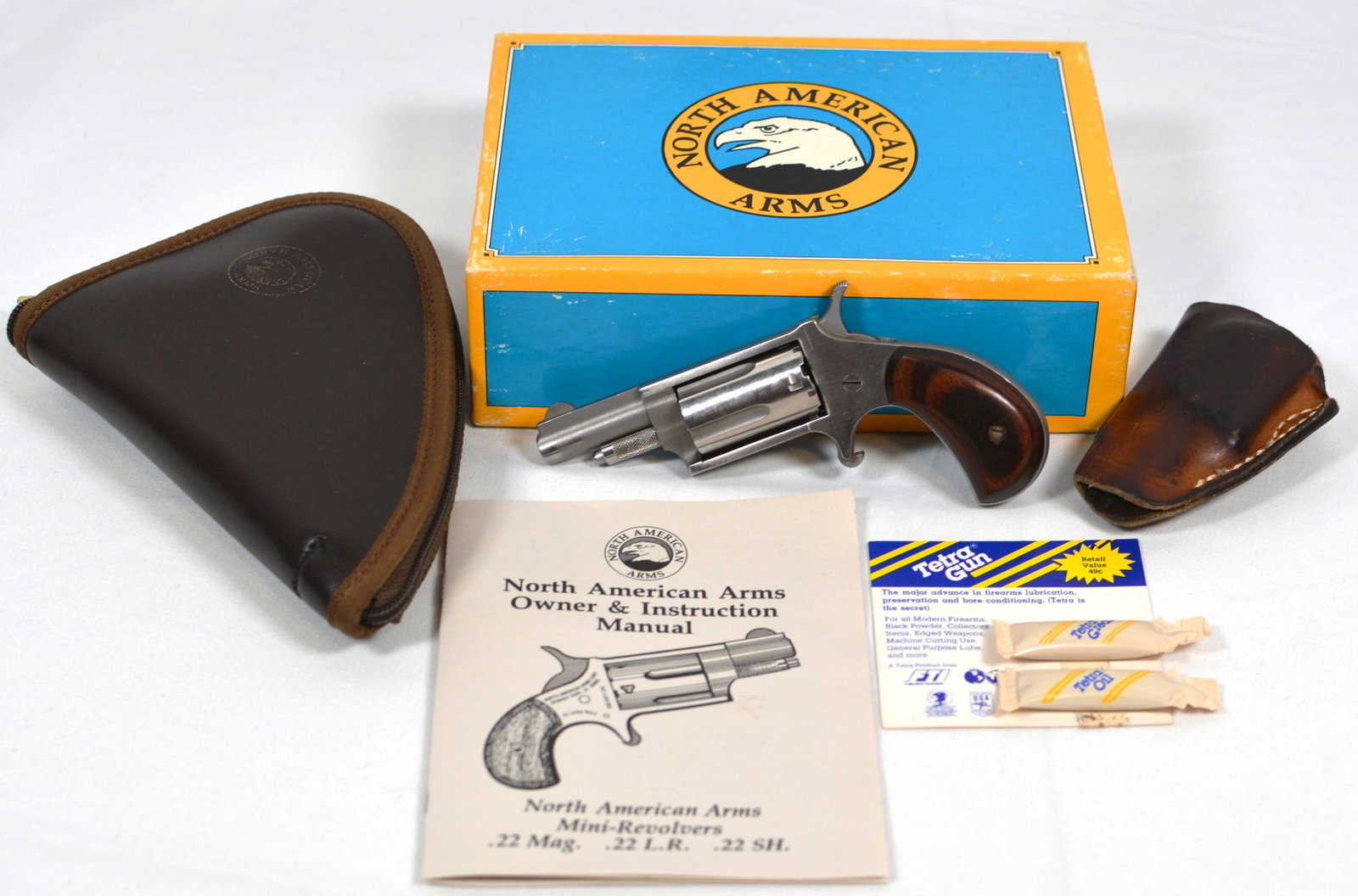 North American Arms Mini Revolver .22 Mag: North American Arms Mini Revolver .22 Mag Serial # W67933 2" barrel, wooden grips, original box, stainless & original manual.