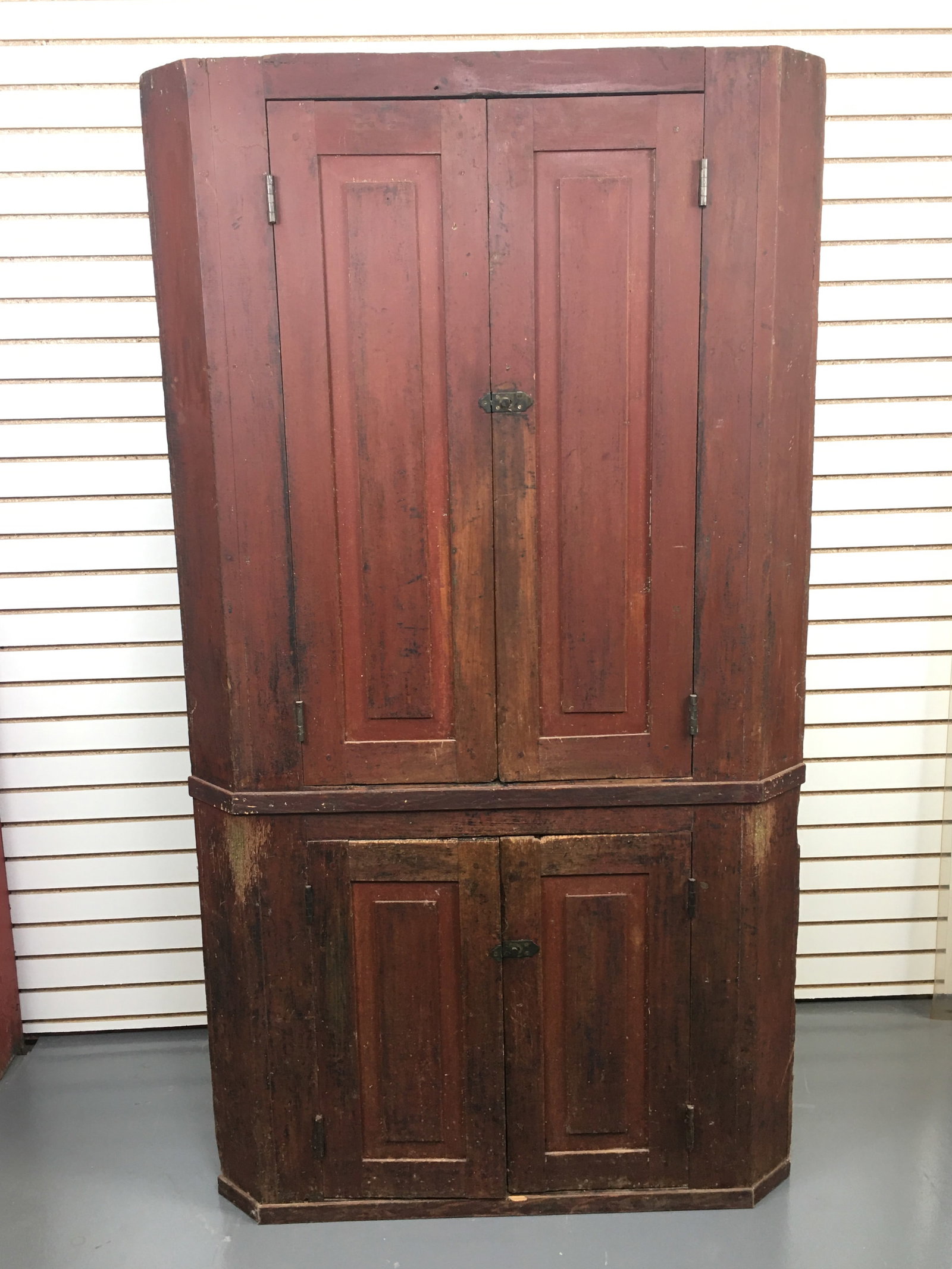 Blind Front Corner Cupboard, Red Paint: Blind Front Corner Cupboard. Two doors over two doors. Red paint to exterior with blue paint on interior of upper doors. Newer hardware. Two 40.5"W x 20.5"D x 70.5"H.