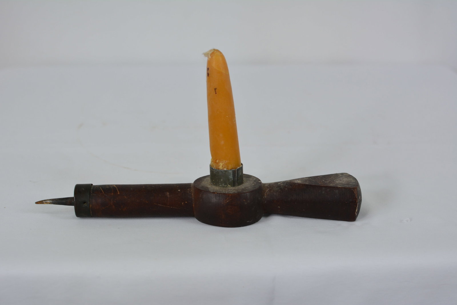 19th Century Wooden Sticking Tom Candle Holder and Metal Awl: Unusual 19th-century wooden sticking Tom lighting tool featuring a turned wood handle fitted with a metal spike. Size: 9 in. L x 1 1/2 in. W x 5 in. H.