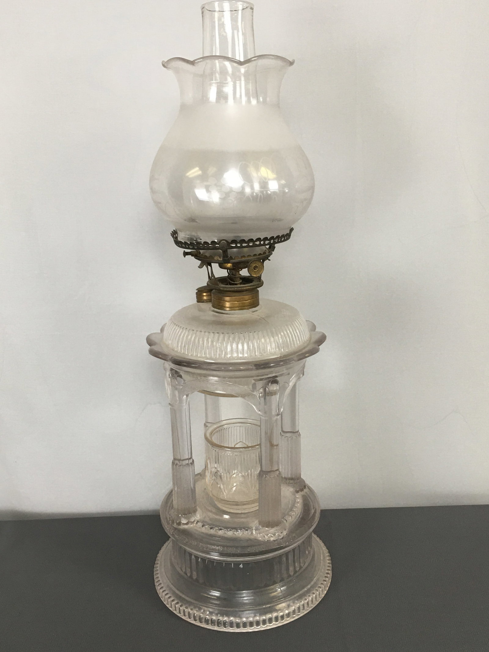 Adam's Temple/Applesauce Kerosene Lamp: Adam's Temple/Applesauce Kerosene Lamp. Clear glass with match holder, chimney and etched shade. Embossed "Patented March 20 1883, July 25, 1882 on base shoulder. 21.25"H w/ chimney.