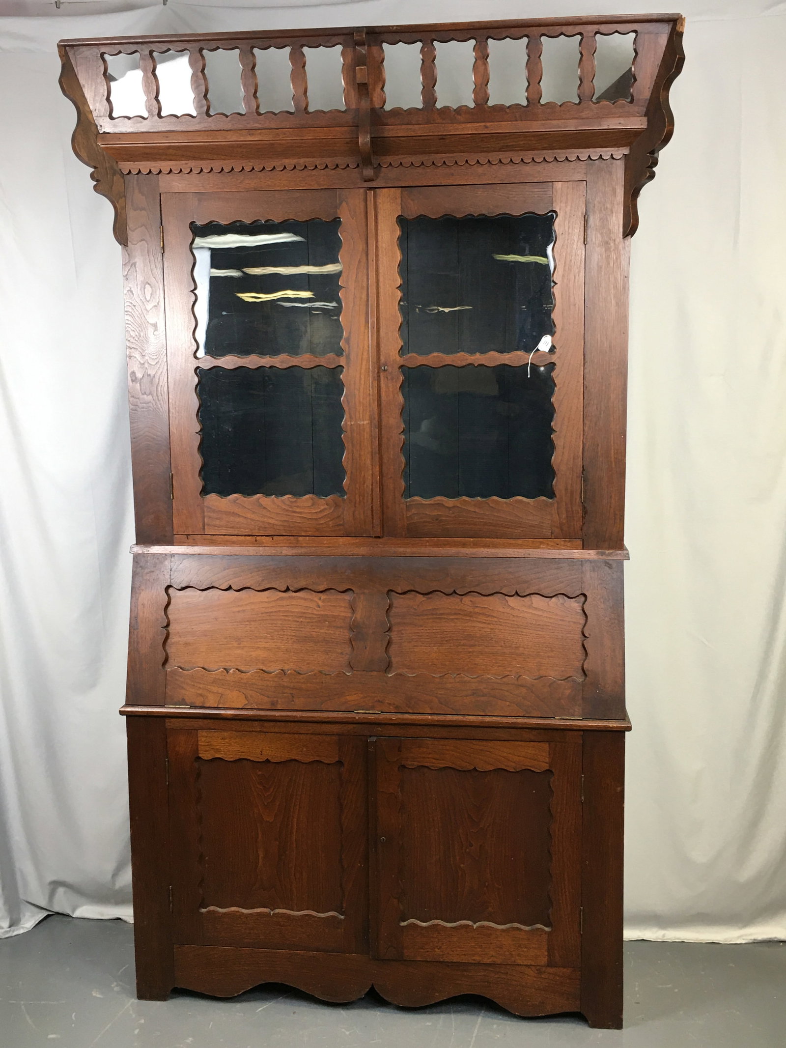 2-Piece Oddfellows Lodge Desk: 2-Piece Oddfellows Lodge Desk. Two doors with scalloped edging on top, with 10 panes of glass for lodge member pictures around upper crown, also edged with scallops. Adjustable rail on inside for