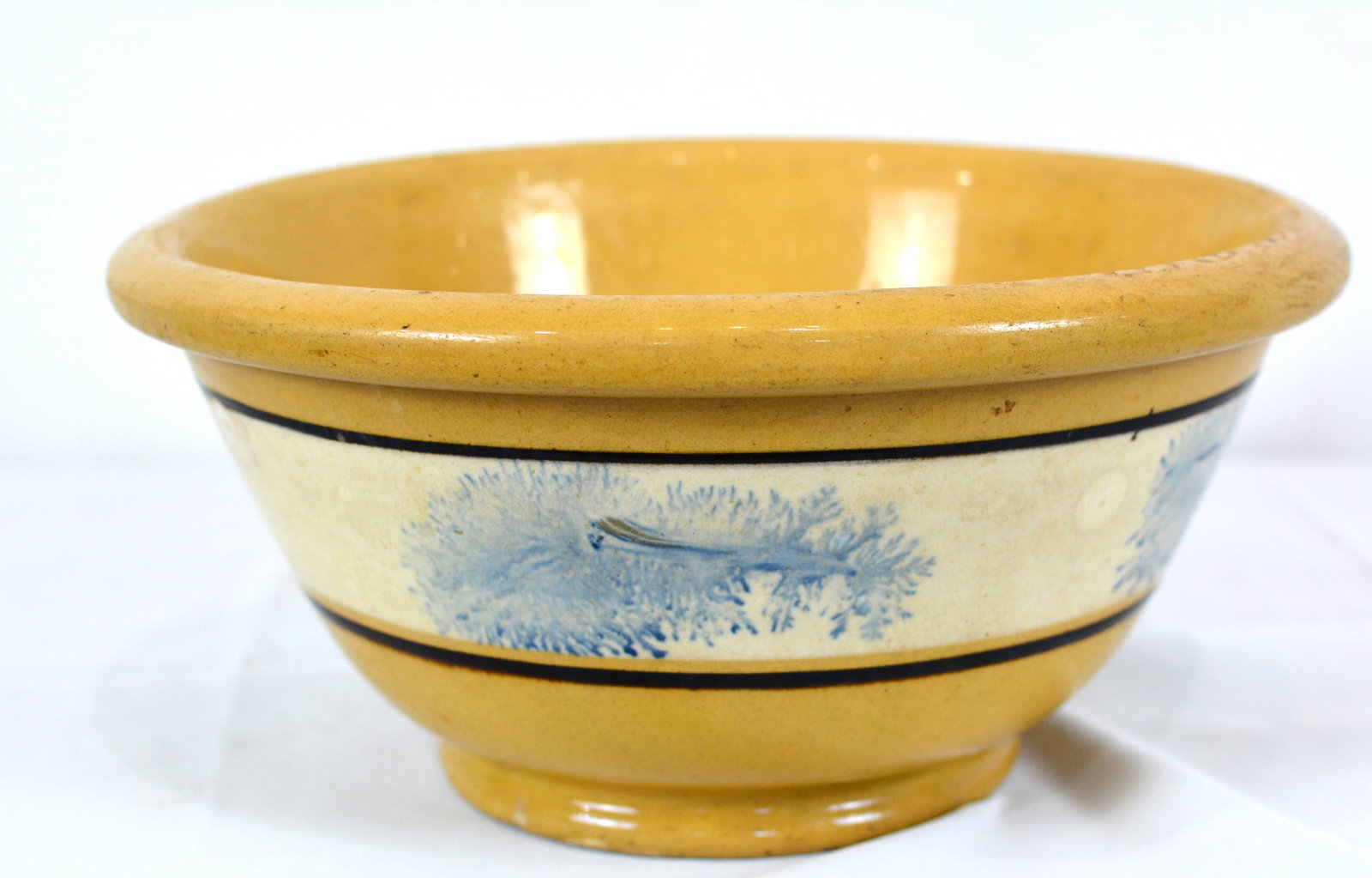 19th Century Yellowware Mixing Bowl with Blue Mocha Decoration: 19th Century Yellowware Mixing Bowl with Blue Mocha Decoration, distinctive cobalt blue mocha-style dendritic motifs framed by dark slip bands. 11 inches D x 5 inches H