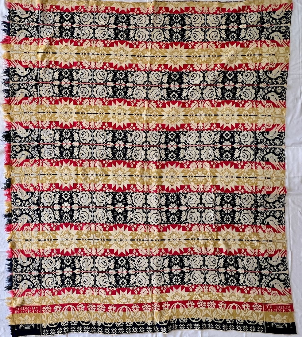 Fredrick A. Kean Jacquard Woven Coverlet, Red, Blue & Cream: Indiana jacquard-woven coverlet by Fredrick A. Kean, Terre Haute, Vigo Co. Indiana. "MADE BY E. KEAN". Alternating bands of floral rosettes, geometric starbursts, scrolling vines, and stylized foliate