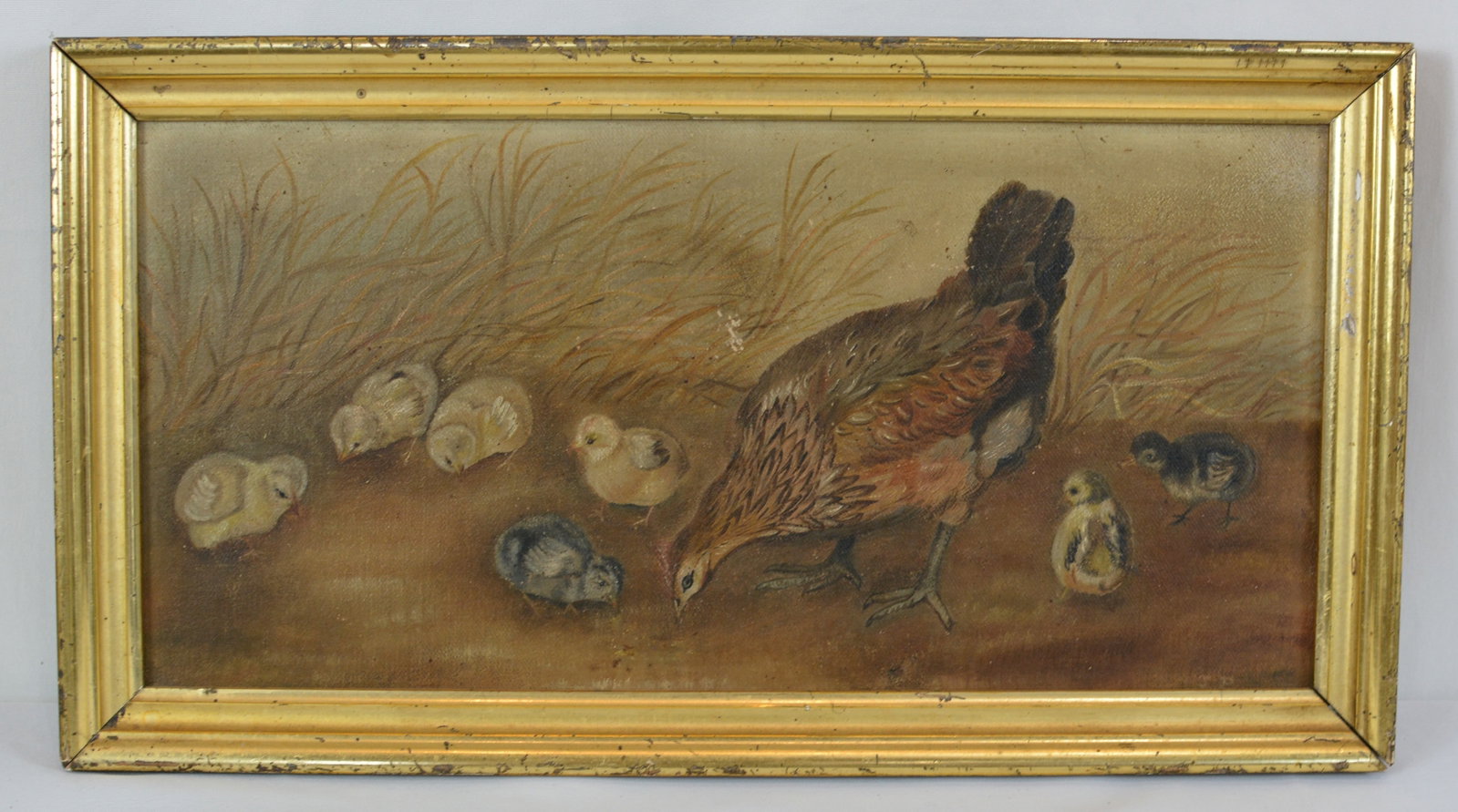 Early Folk Art Oil Painting of Hen and Chicks in Gilt Frame: Early folk art oil painting depicting a mother hen surrounded by her chicks in a rustic farmyard setting. Presented in a period giltwood frame that complements the painting. Frame: 17 1/2 inches wide 