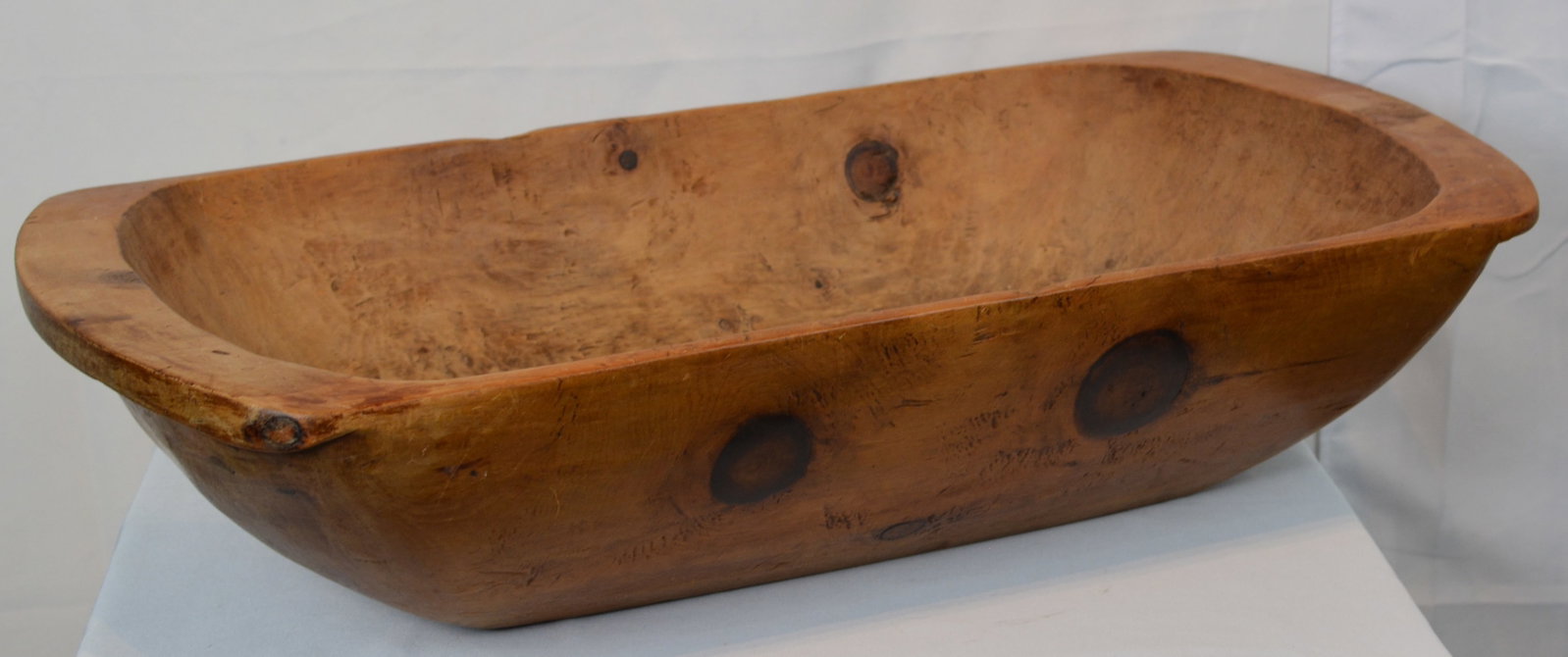 Early Trencher Dough Bowl, 19th Century: Large early American hand-carved wooden trencher dough bowl, first half 19th century. 29 in. L x 15 in. W x 6 in. H.