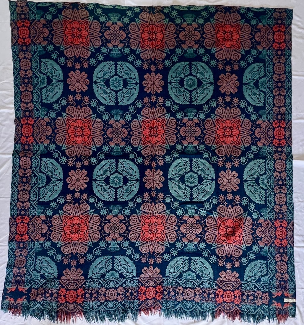 1850's Indiana Patriotic Coverlet: 1850's Jacquard-woven wool coverlet featuring corner blocks with birds and "Liberty", vibrant coral-red, navy blue, and teal coloration with elaborate floral medallions, starbursts, and scrolling foli