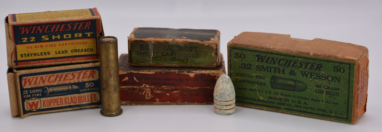 Collection of Early Winchester Ammunition Boxes & Cartridge: Interesting collection of early Winchester ammunition boxes and cartridge-related items. The lot includes several original Winchester cartridge boxes, including .22 Short Rim Fire, .22 Long Rim Fire "