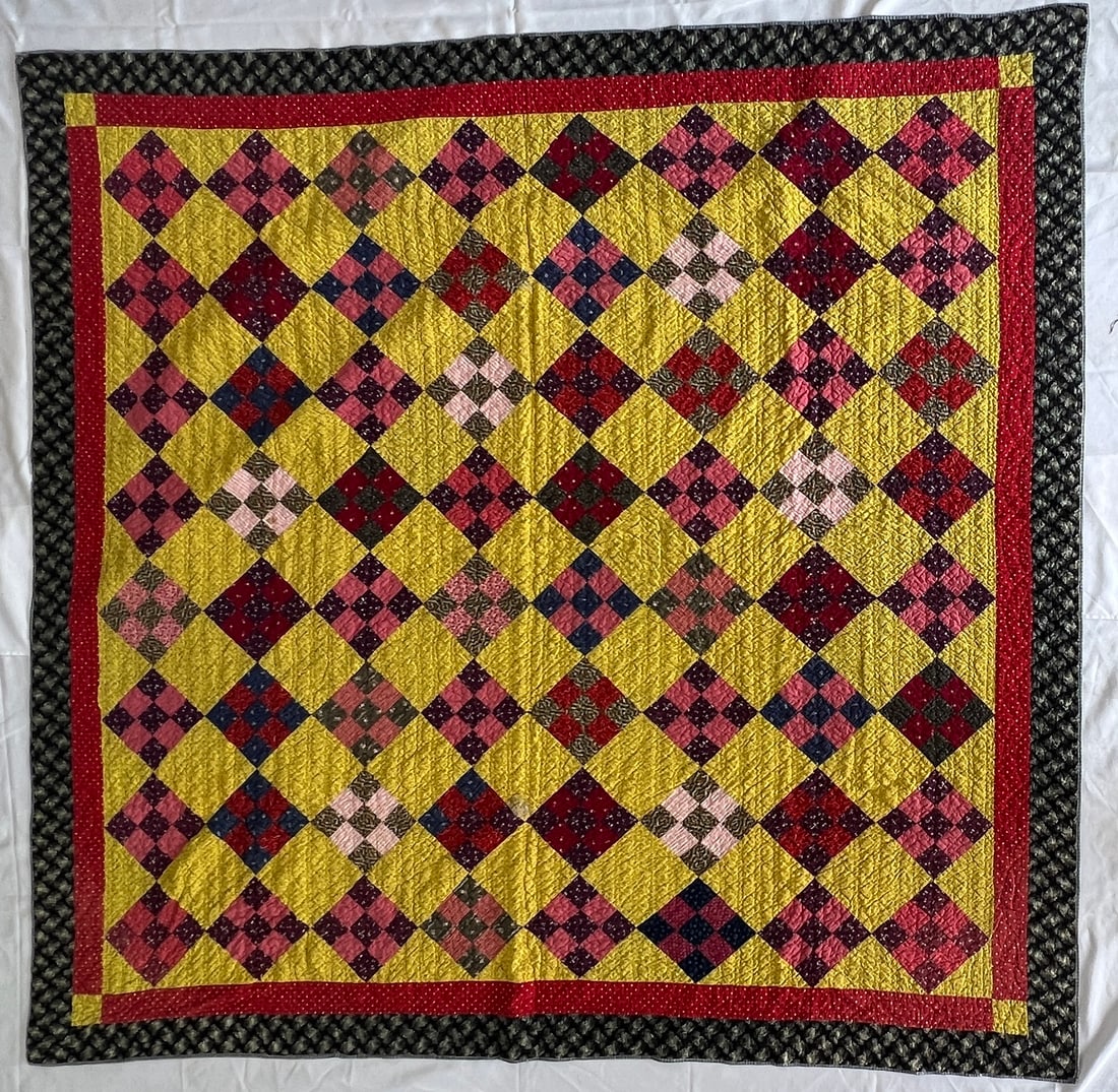 Nine Patch Variation Quilt with Yellow Back Ground (1 of 3)