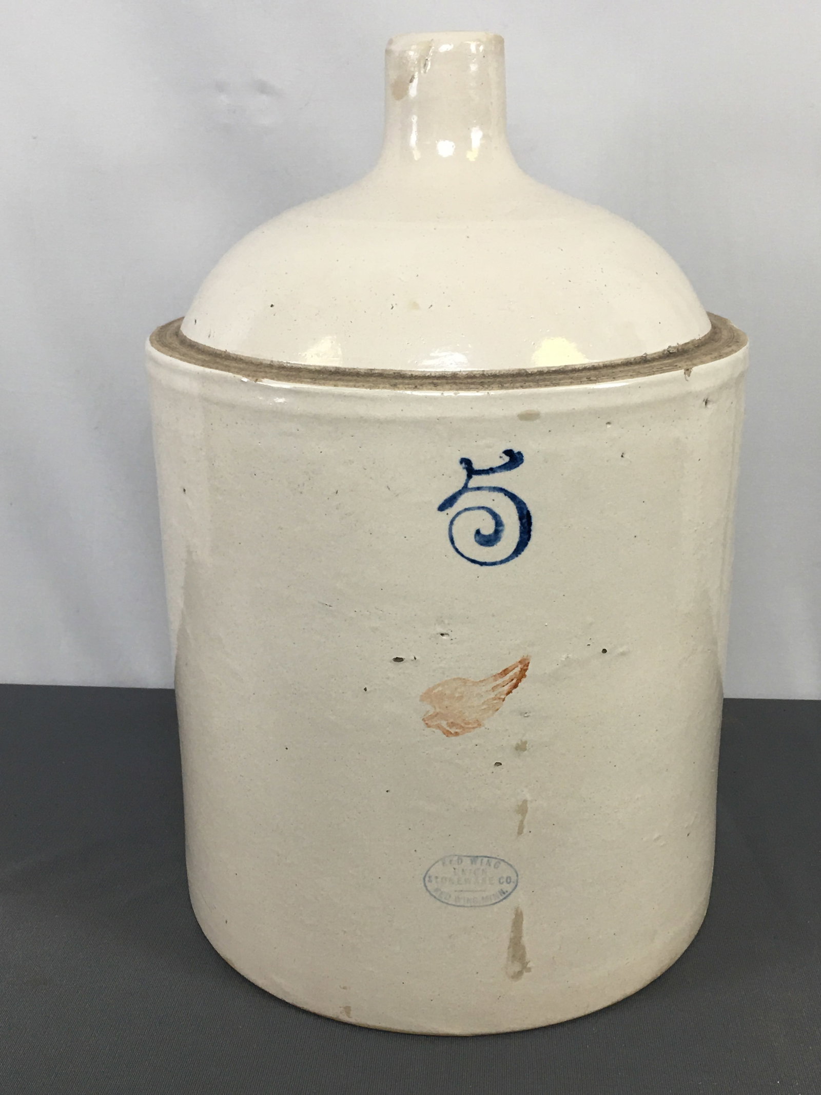 5 Gallon Red Wing Stoneware Jug: 5 Gallon Red Wing Stoneware Jug. 2" wing. 17.5"H